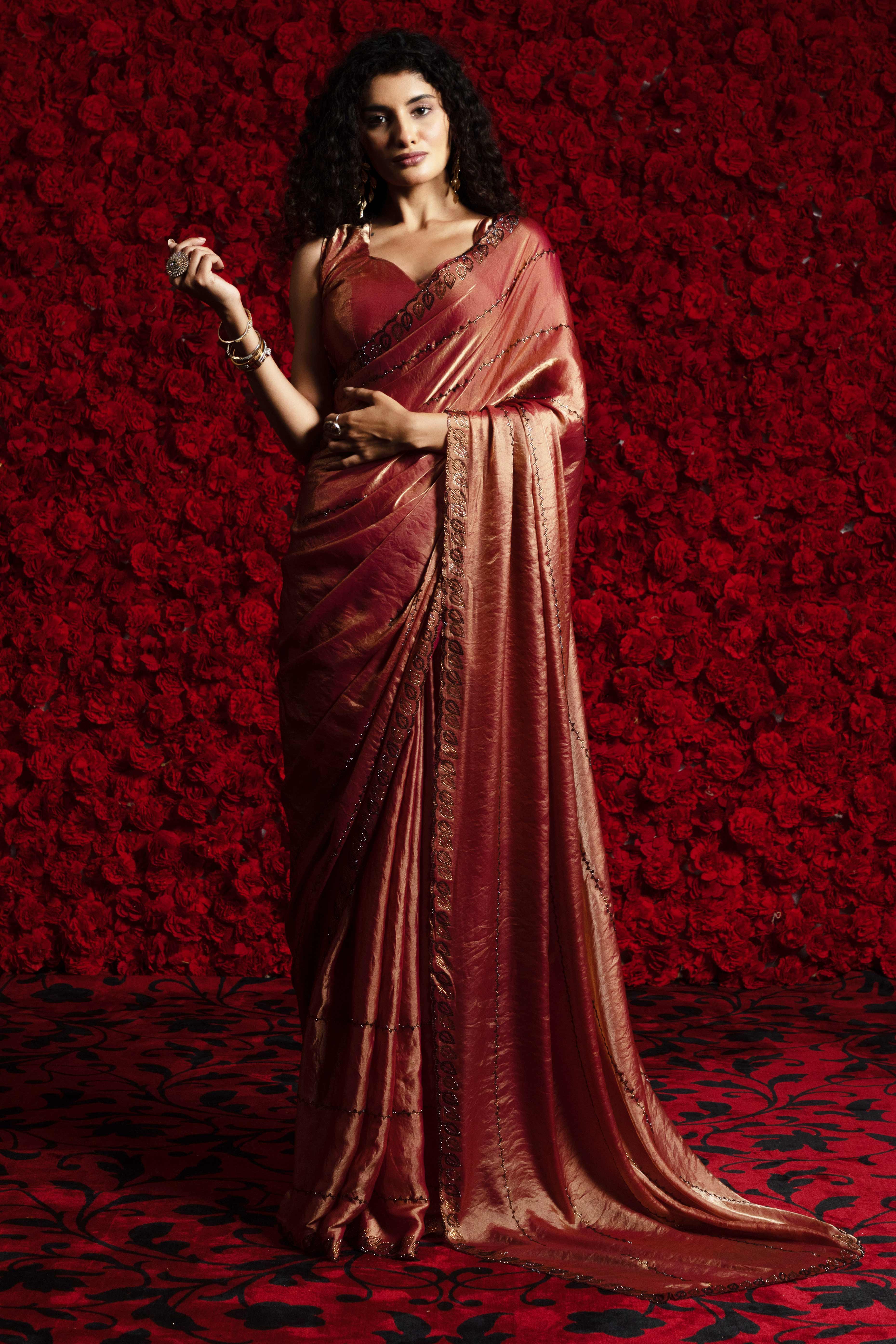 Brick Red Satin Silk Saree with Dazzling Stone Embellishments for Special Occasions
