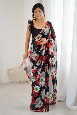 Black Georgette Saree Featuring Floral Prints & Shimmering Mirror Work Border