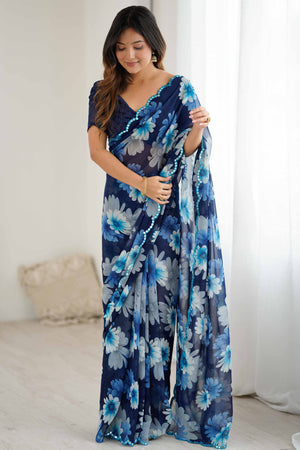 Blue Georgette Saree Featuring Floral Prints & Shimmering Mirror Work Border