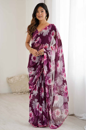 Purple Georgette Saree Featuring Floral Prints & Shimmering Mirror Work Border