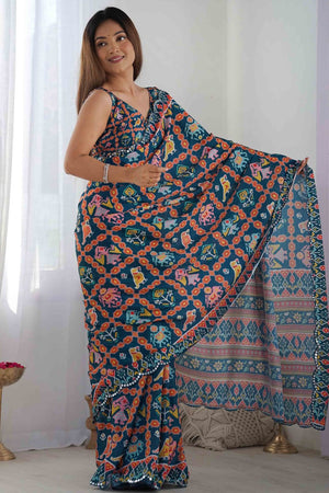 Dark Teal Blue Digital Print Georgette Saree Enhanced With A Sparkling Lace Border