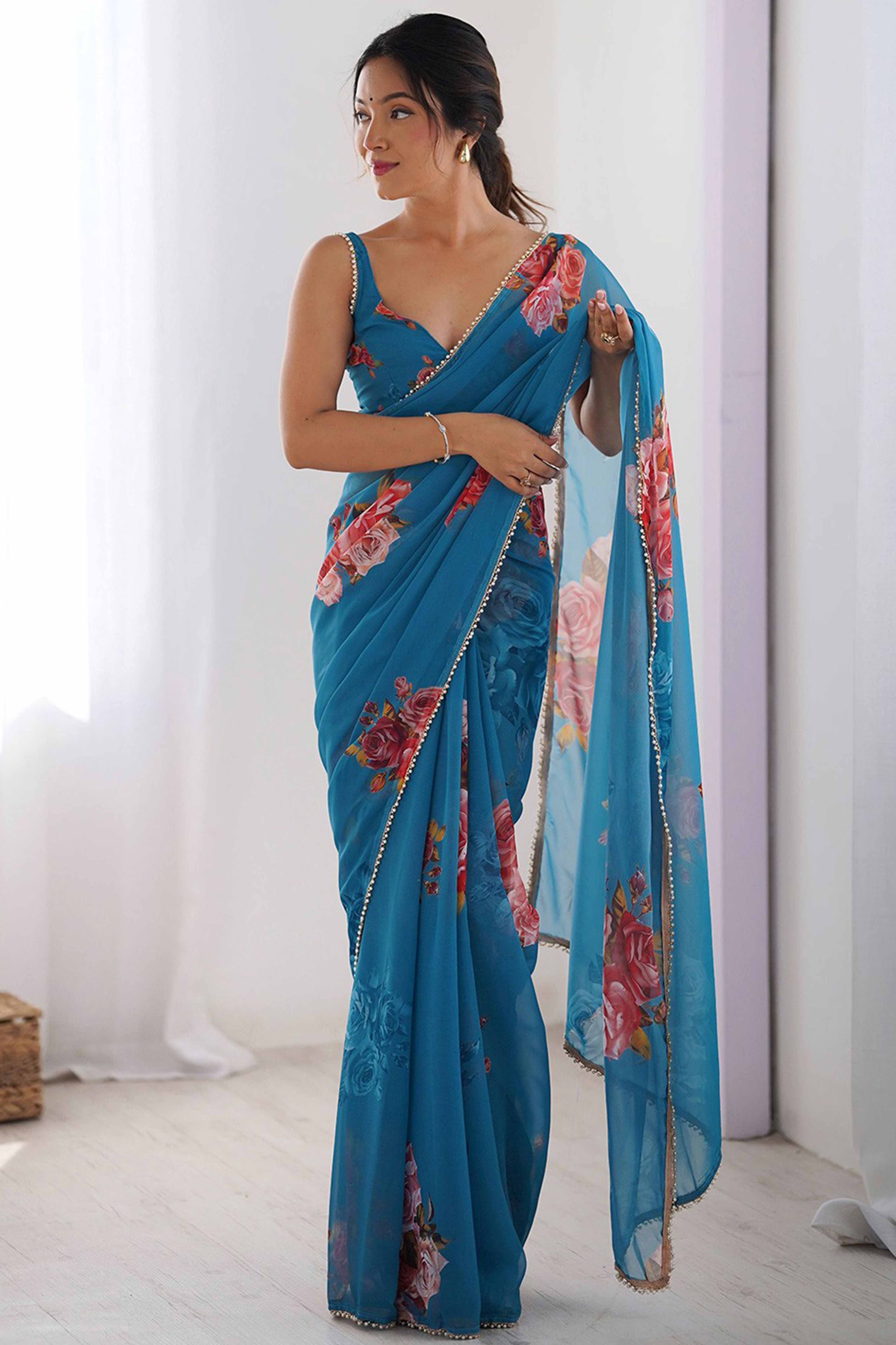 Partywear Teal Georgette Saree with Floral Prints and Bead Work Lace
