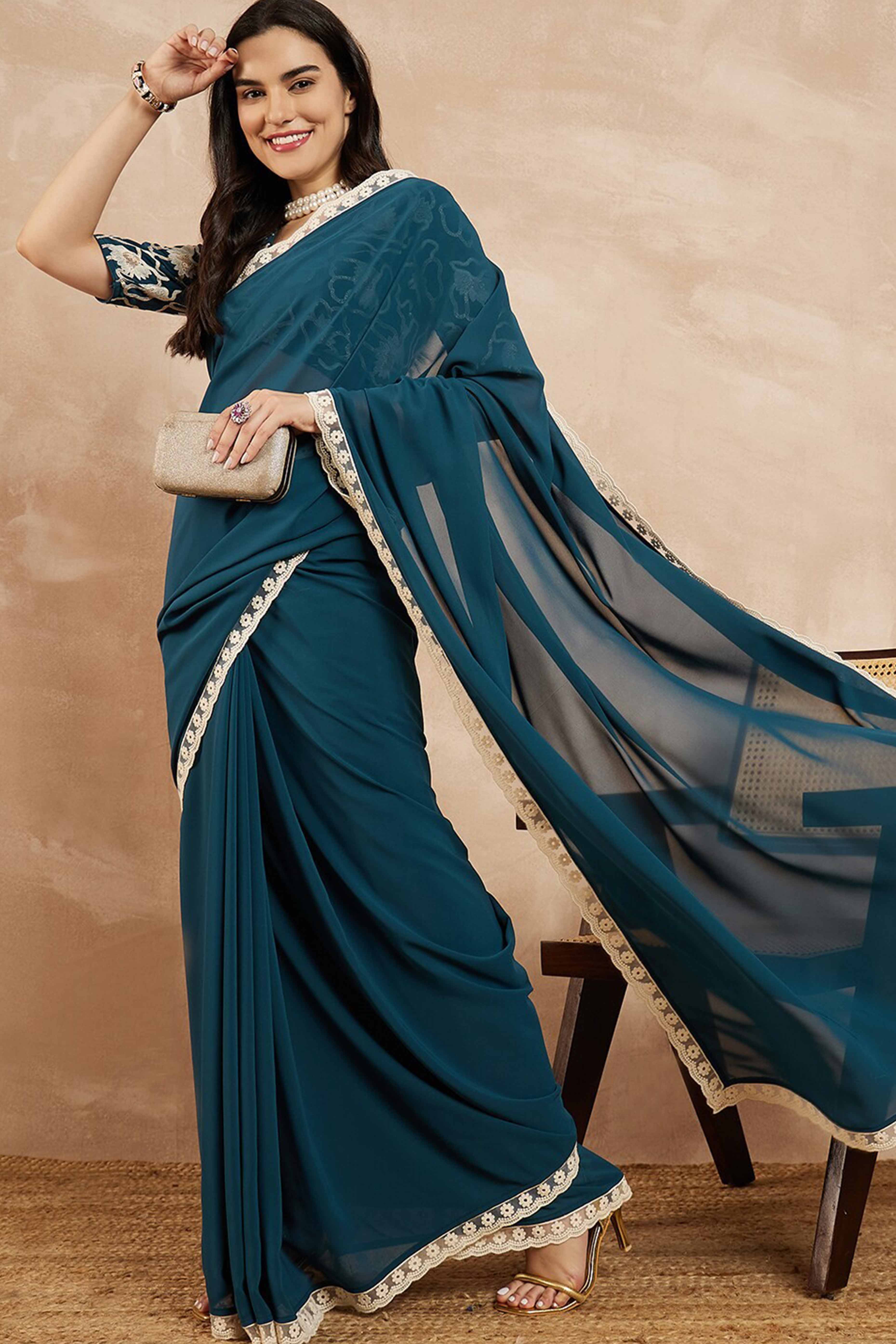 Teal Blue Solid Georgette Saree With Embroidered Border