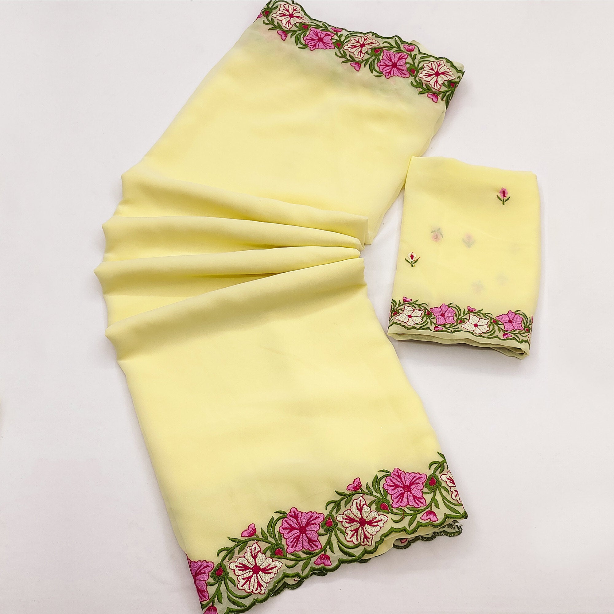 Yellow Faux Georgette Saree Featuring Minimalist Floral Border Embroidery