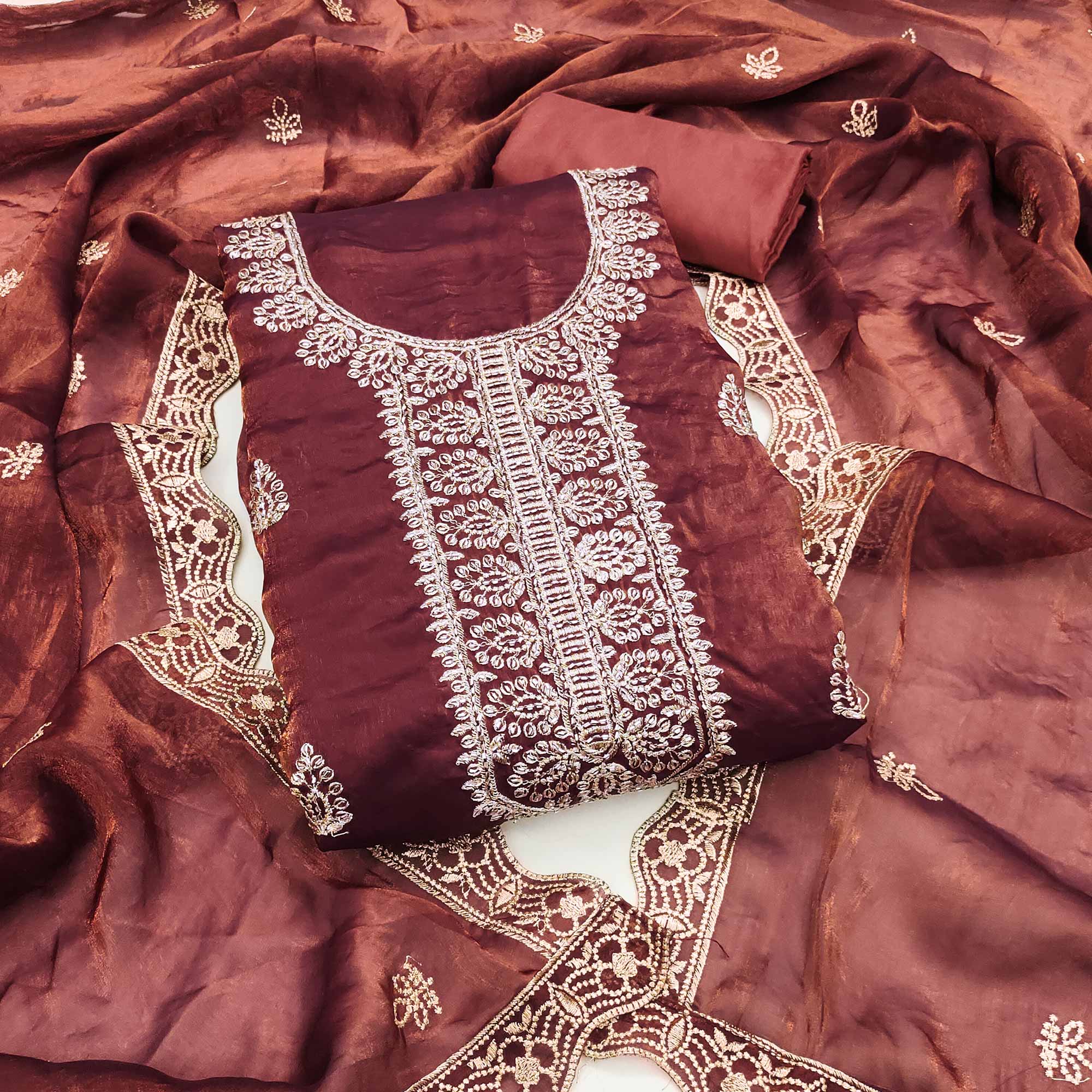 Rust Satin Dress Material Adorned With Elegant Floral Zari Embroidery & Intricate Handwork