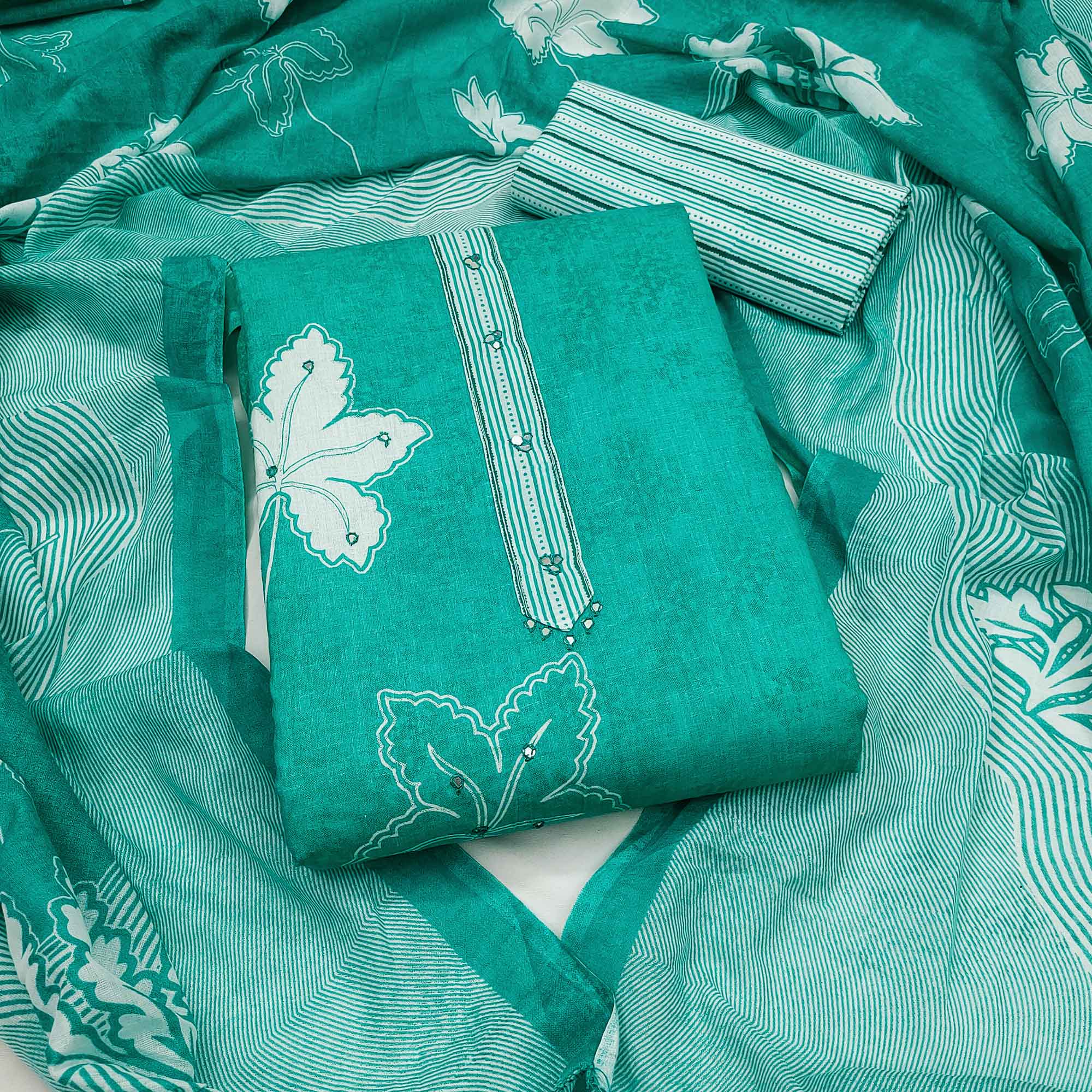 Charming Turquoise Floral & Leaf Printed Pure Cotton Dress Material Featuring Subtle Embroidery Work