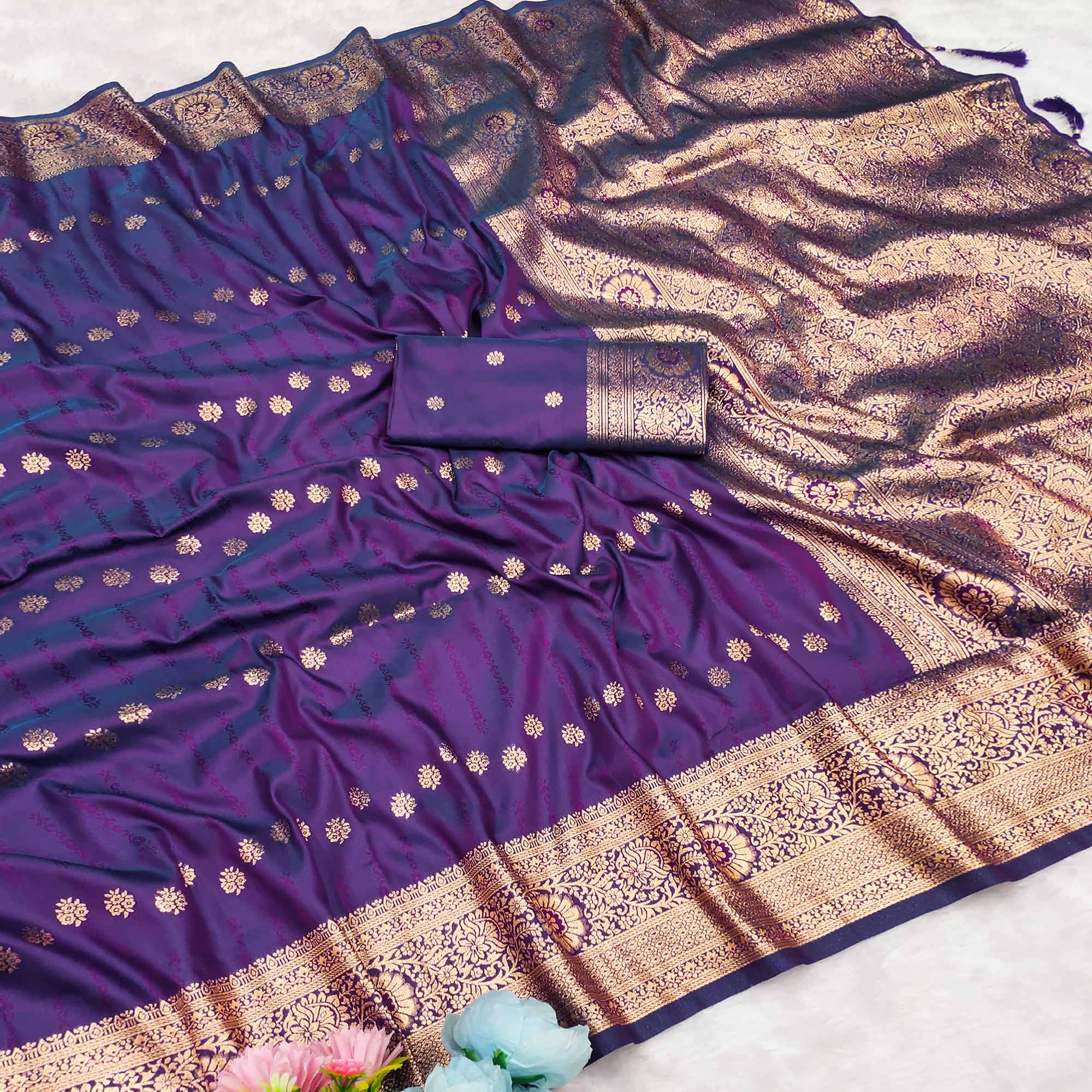 Violet Zari-Woven Cotton Silk Saree Featuring a Graceful Drape and Delicate Tassel Detailing