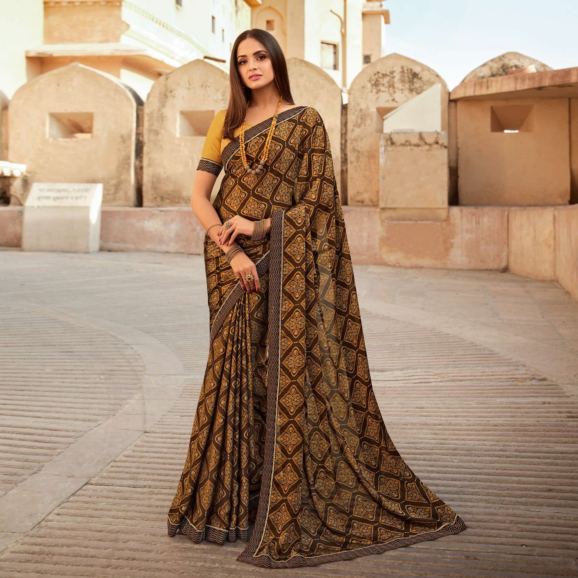 Brown Printed With Embroidered Border Georgette Saree
