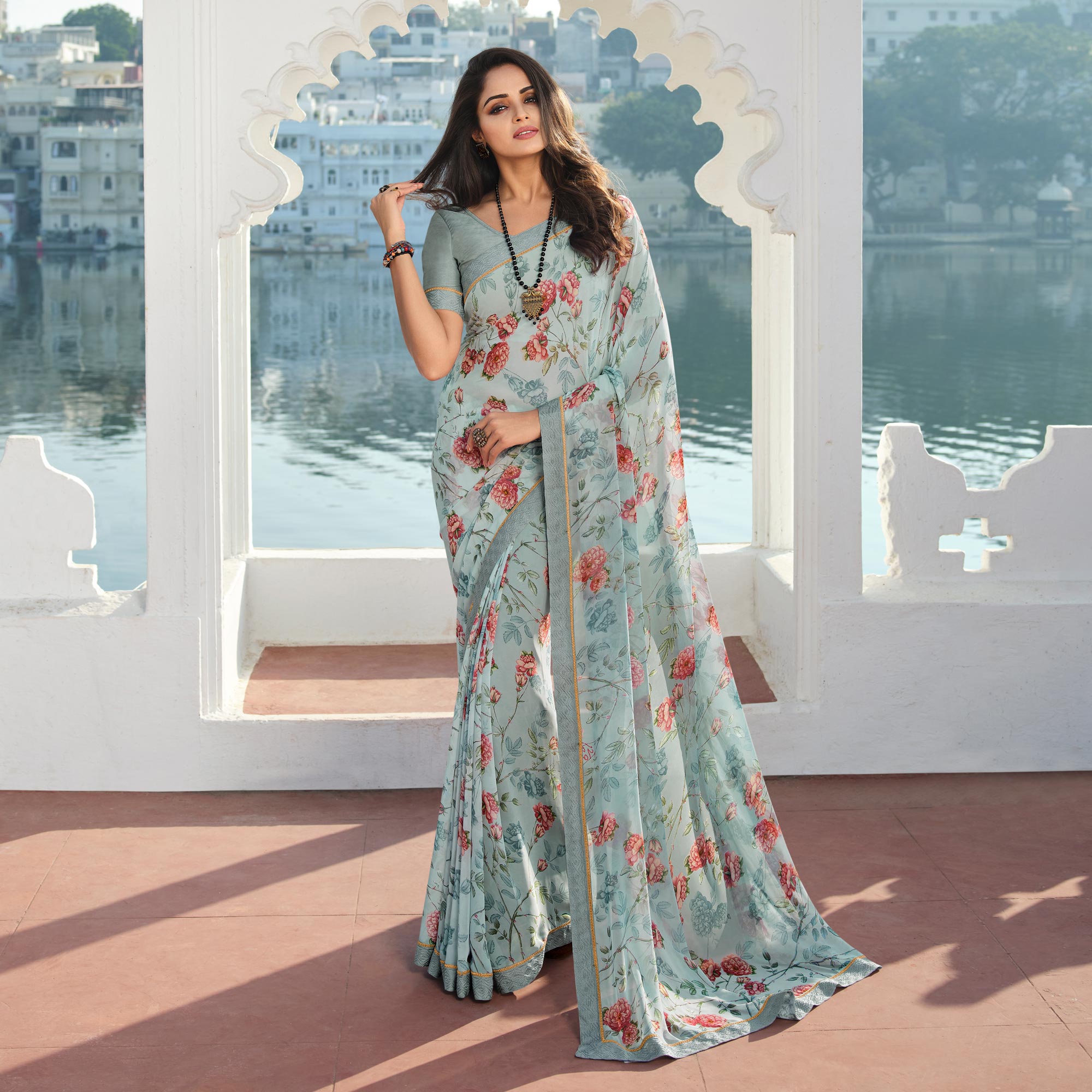 Sky Blue  Floral Printed With Embroidered Border Georgette Saree