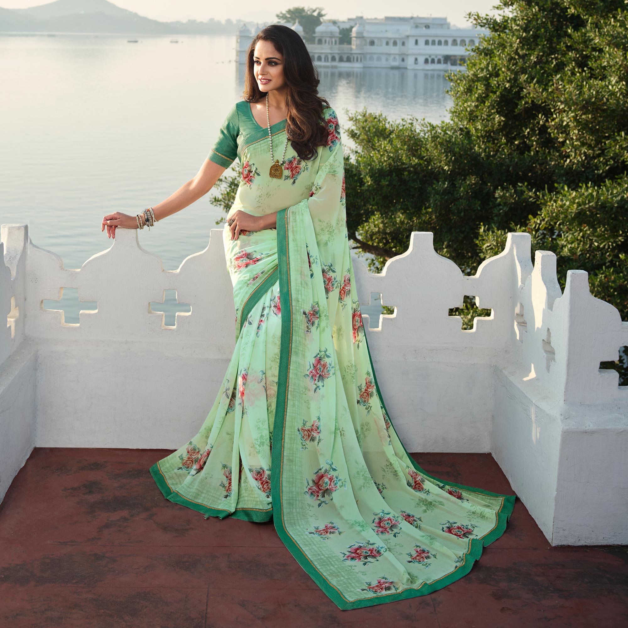 Turquoise Floral Printed With Embroidered Border Georgette Saree