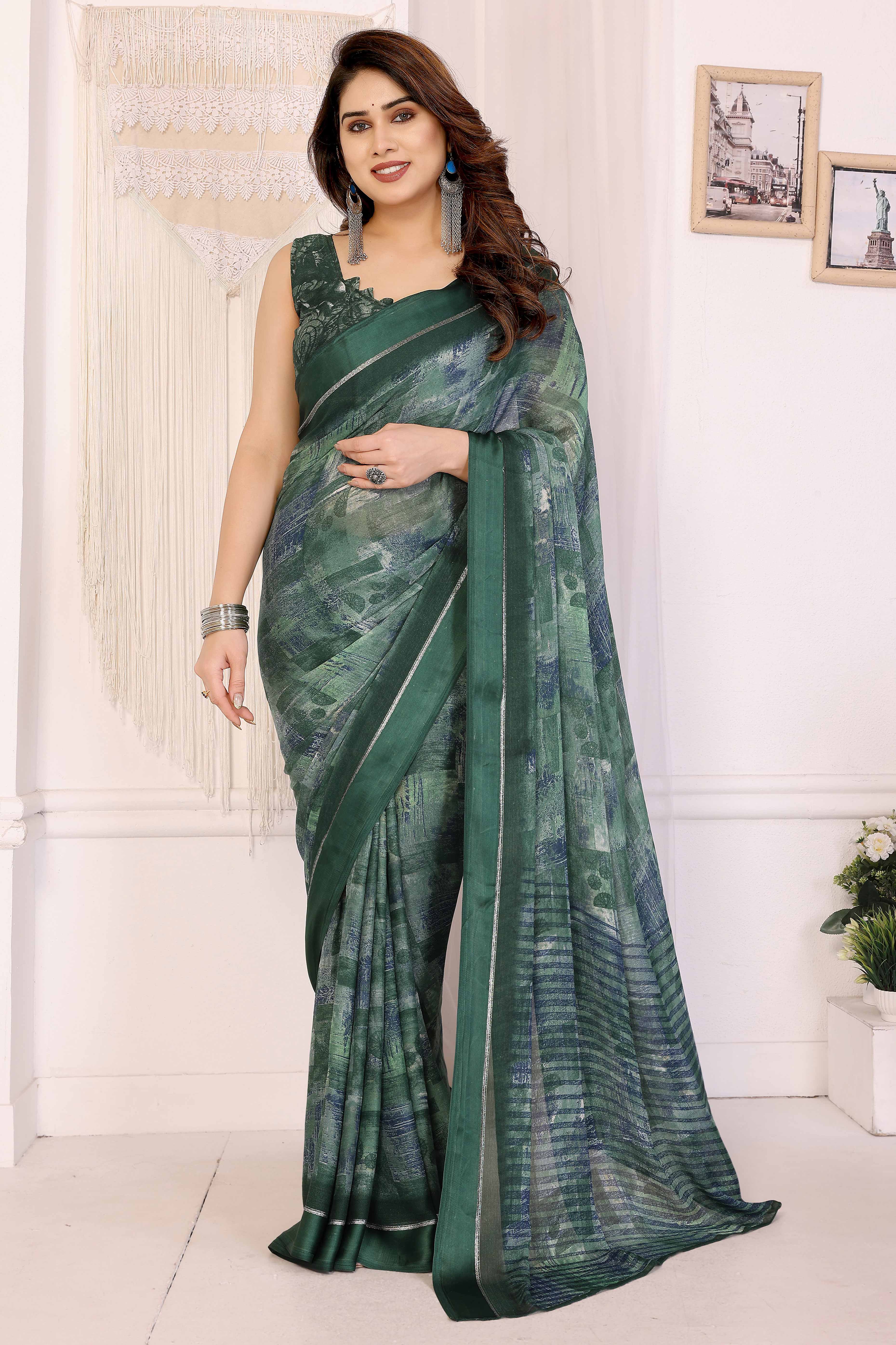 Trendy Green Moss Crepe Saree with Floral Motifs and Satin Border