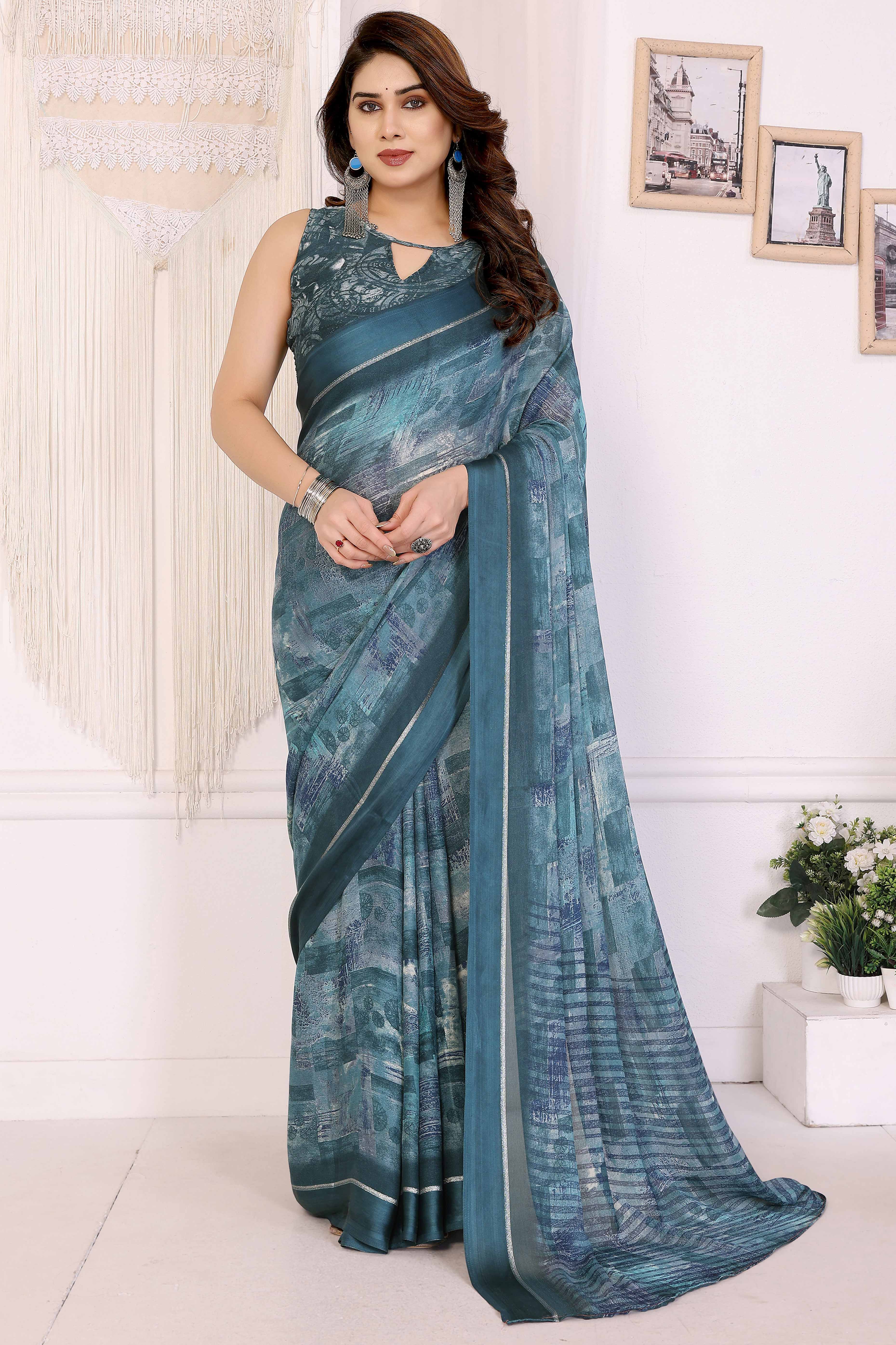 Trendy Teal Moss Crepe Saree with Floral Motifs and Satin Border