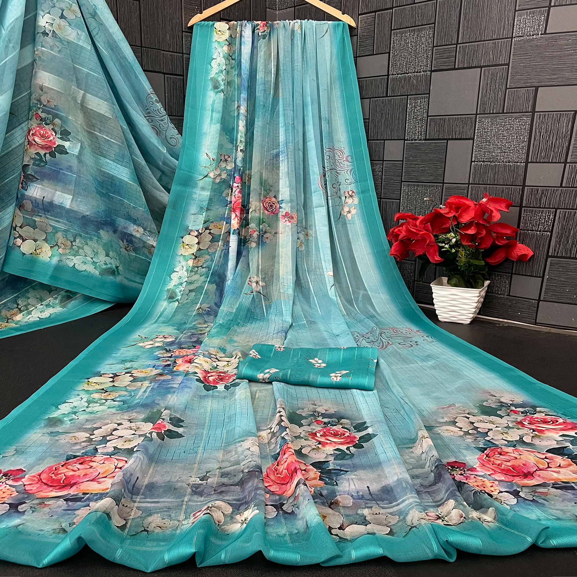 Charming Turquoise Blue Floral Digital Printed Georgette Saree Accentuated With Zari Stripes