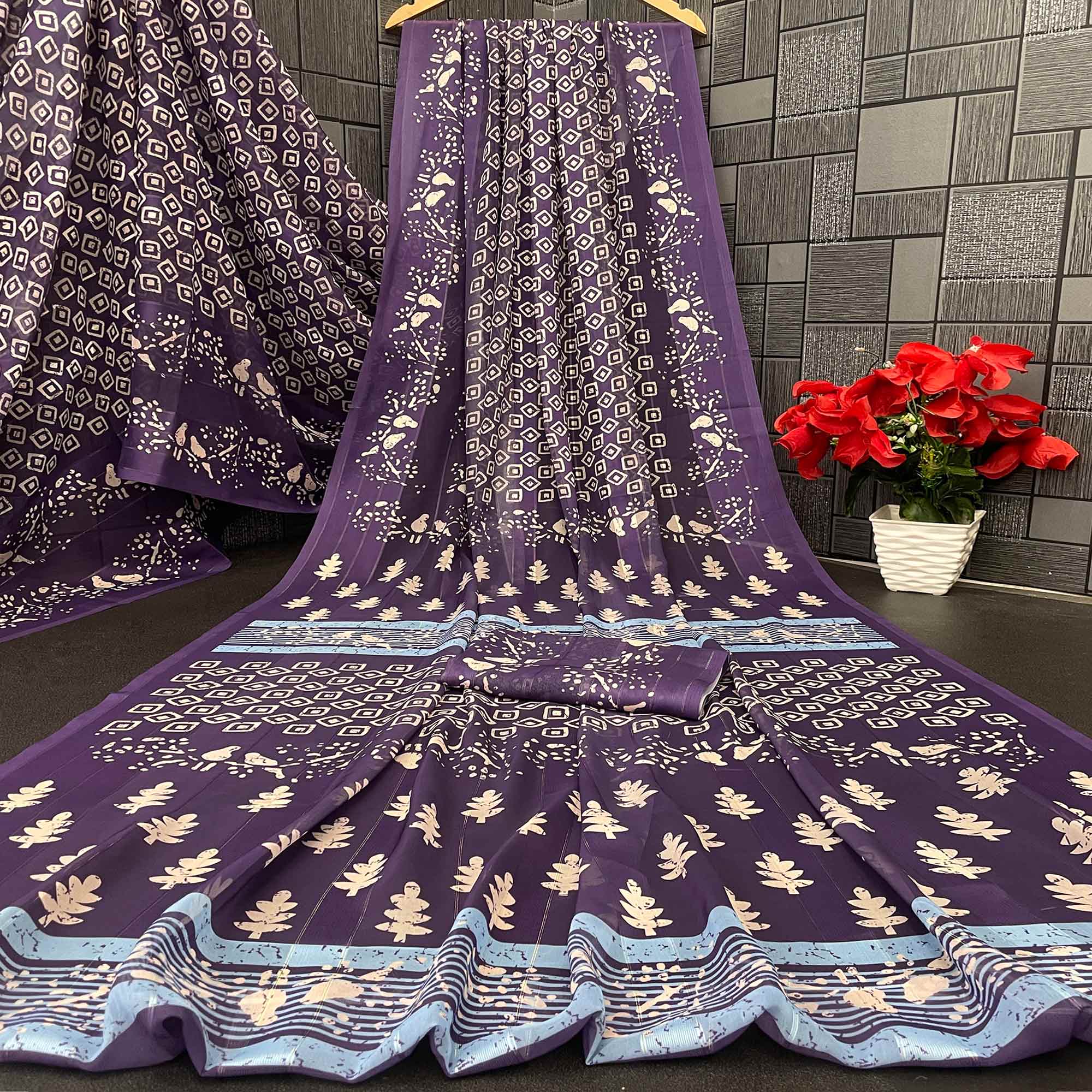 Charming Purple Geometric Digital Printed Georgette Saree Accentuated With Zari Stripes