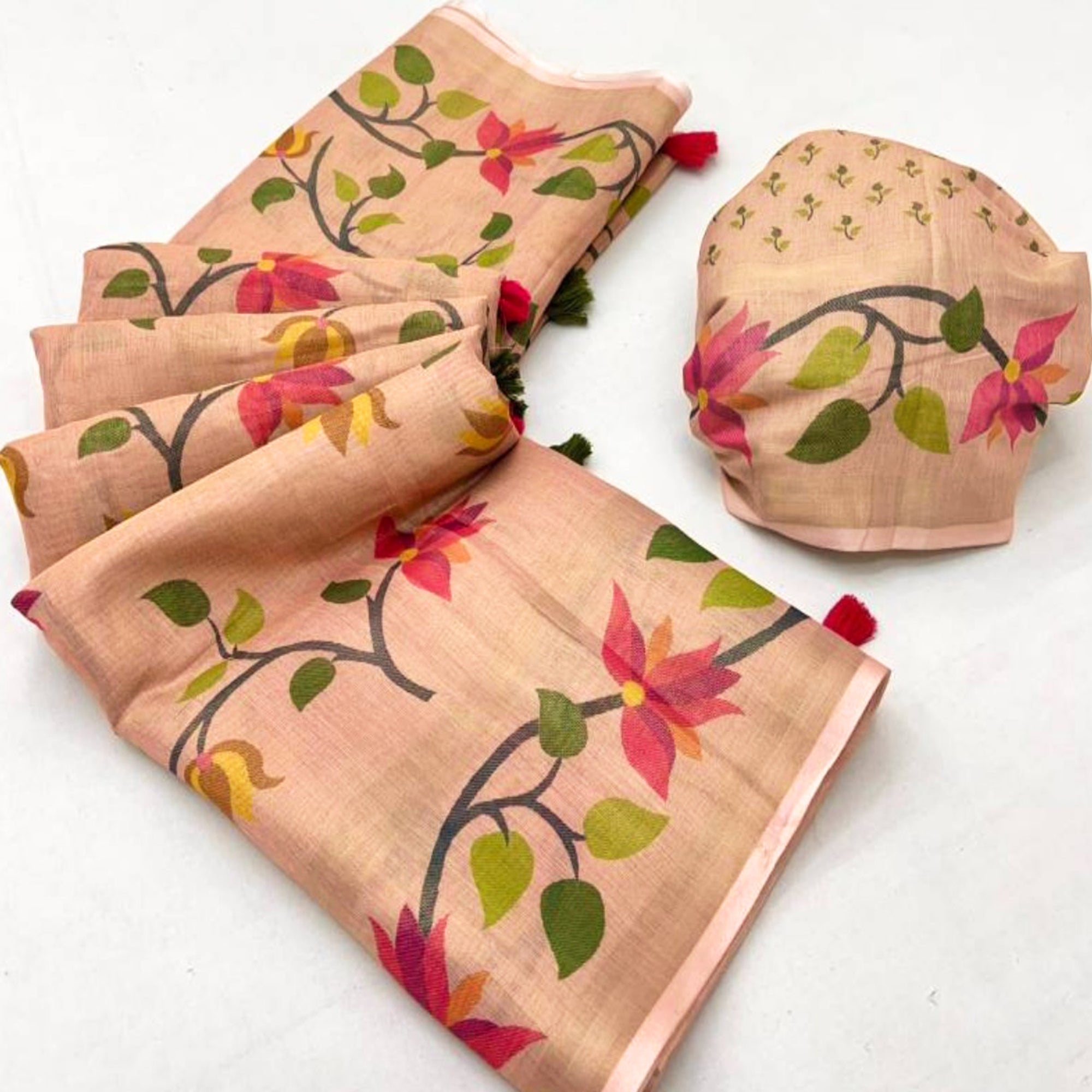 Peach Floral Printed Tissue Cotton Silk Saree Enhanced with a Classic Zari Weaving Border