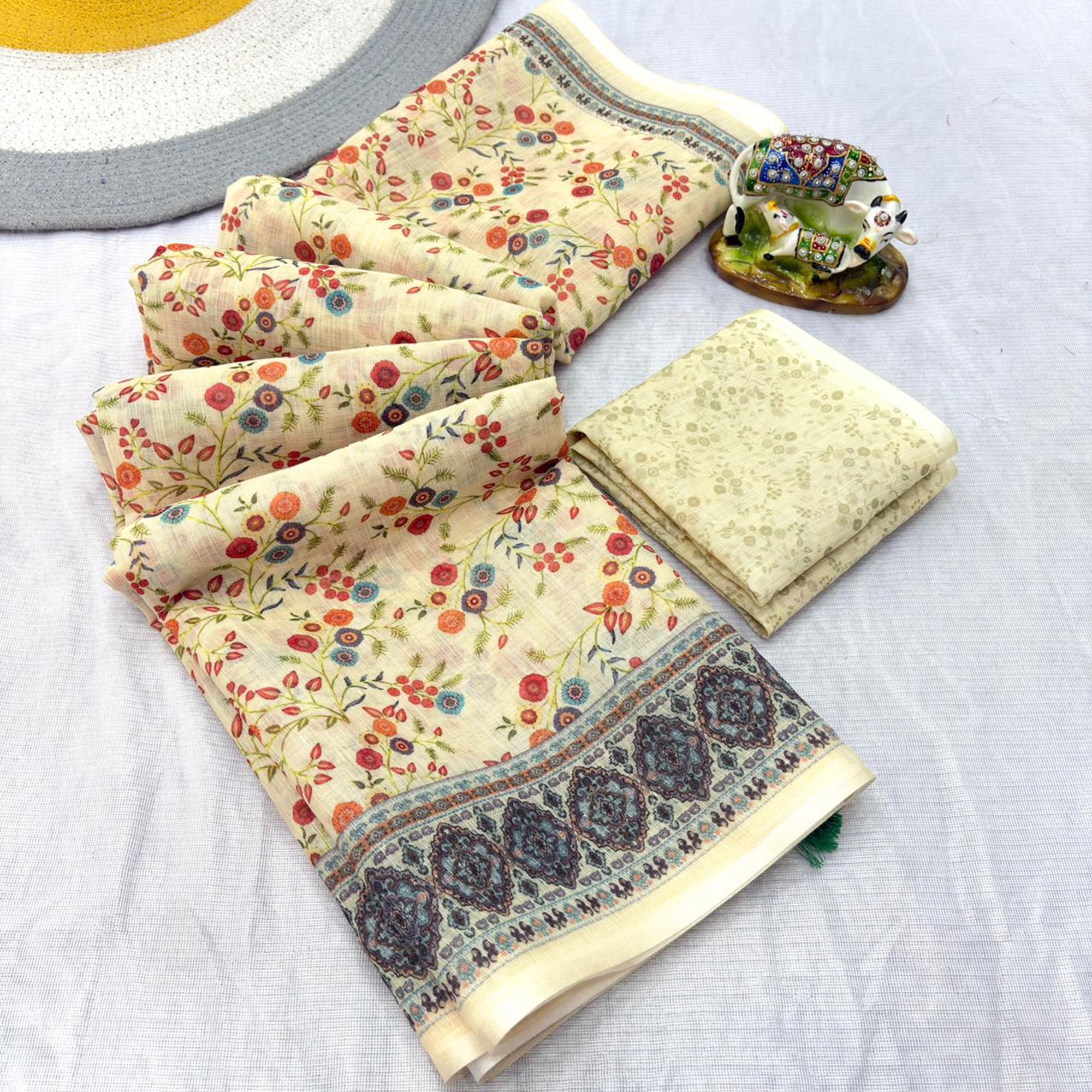 Luxurious Cream Floral Printed Linen Cotton Saree with Decorative Fancy Latkan Pallu