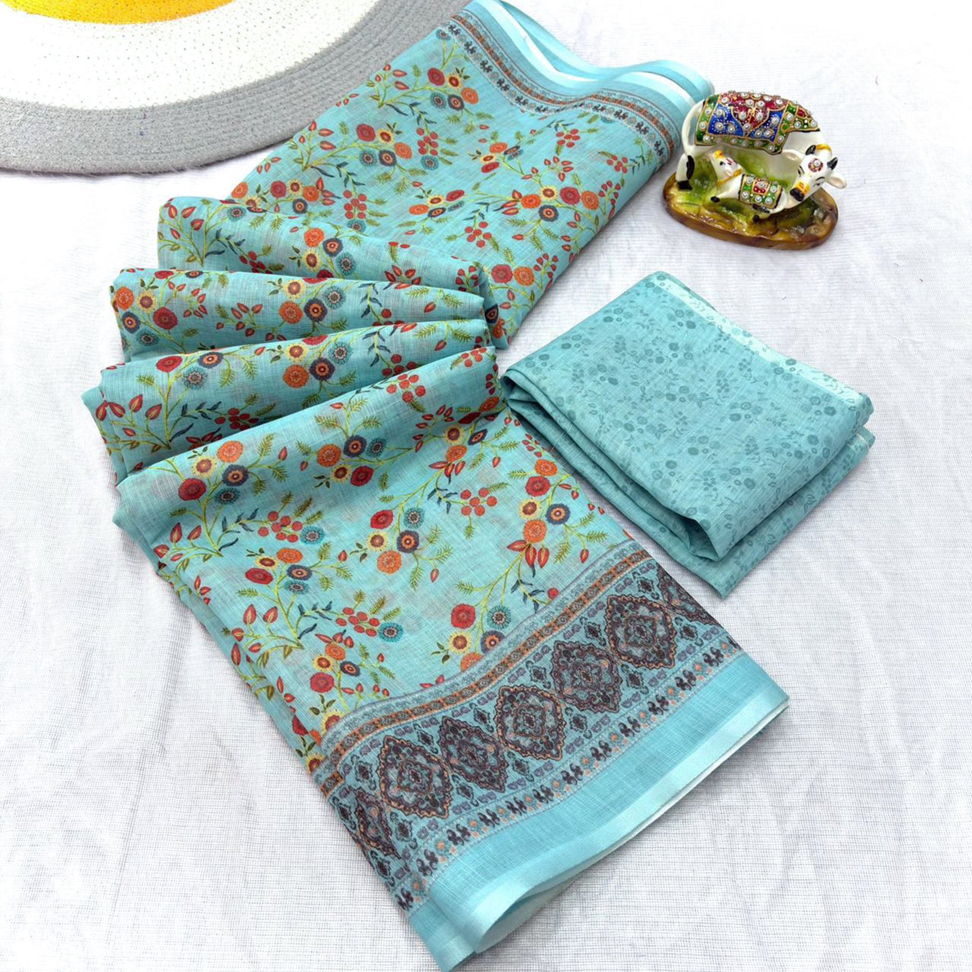 Luxurious Pale Turquoise Floral Printed Linen Cotton Saree with Decorative Fancy Latkan Pallu