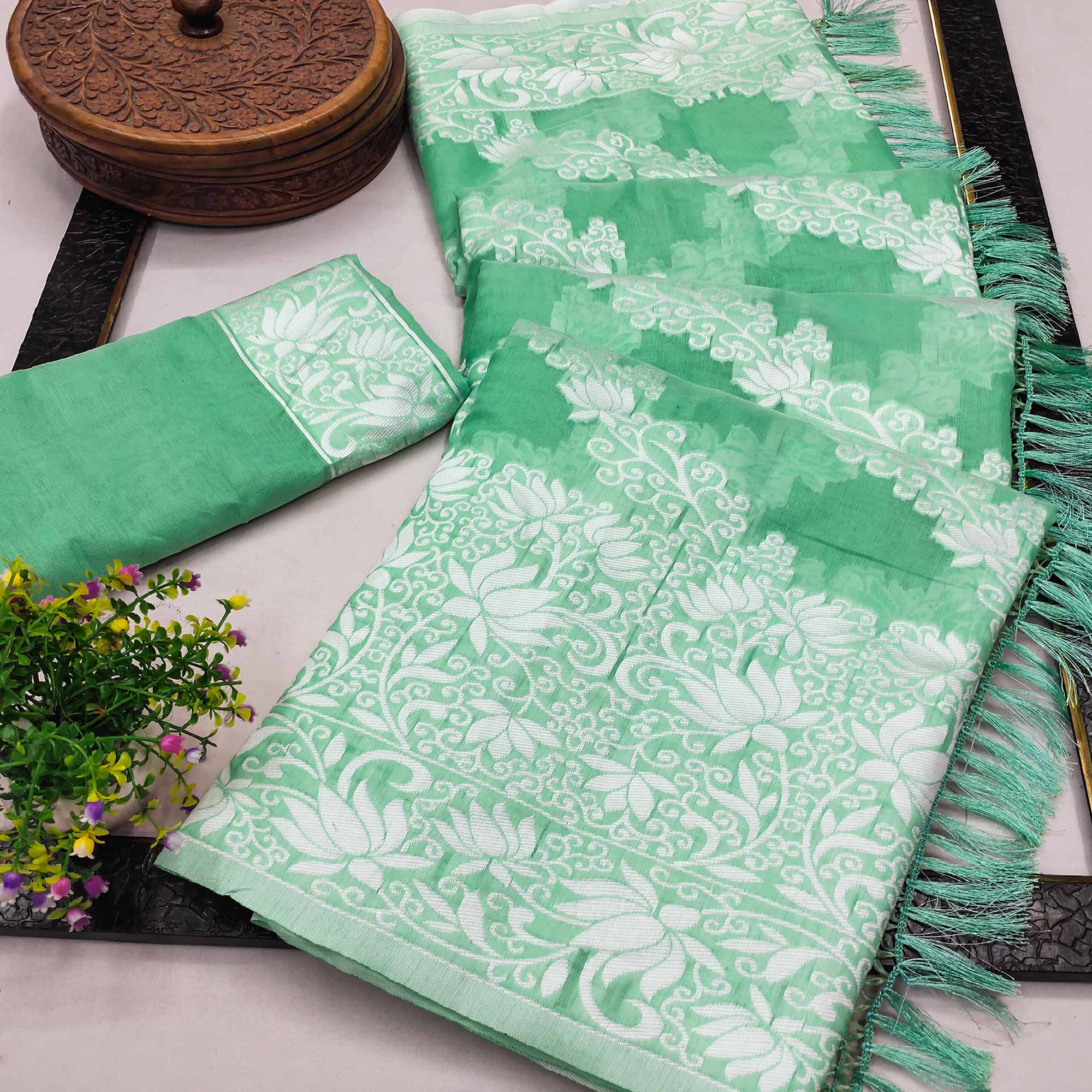 Rama Green Floral Woven Banarasi Silk Saree With Tassels