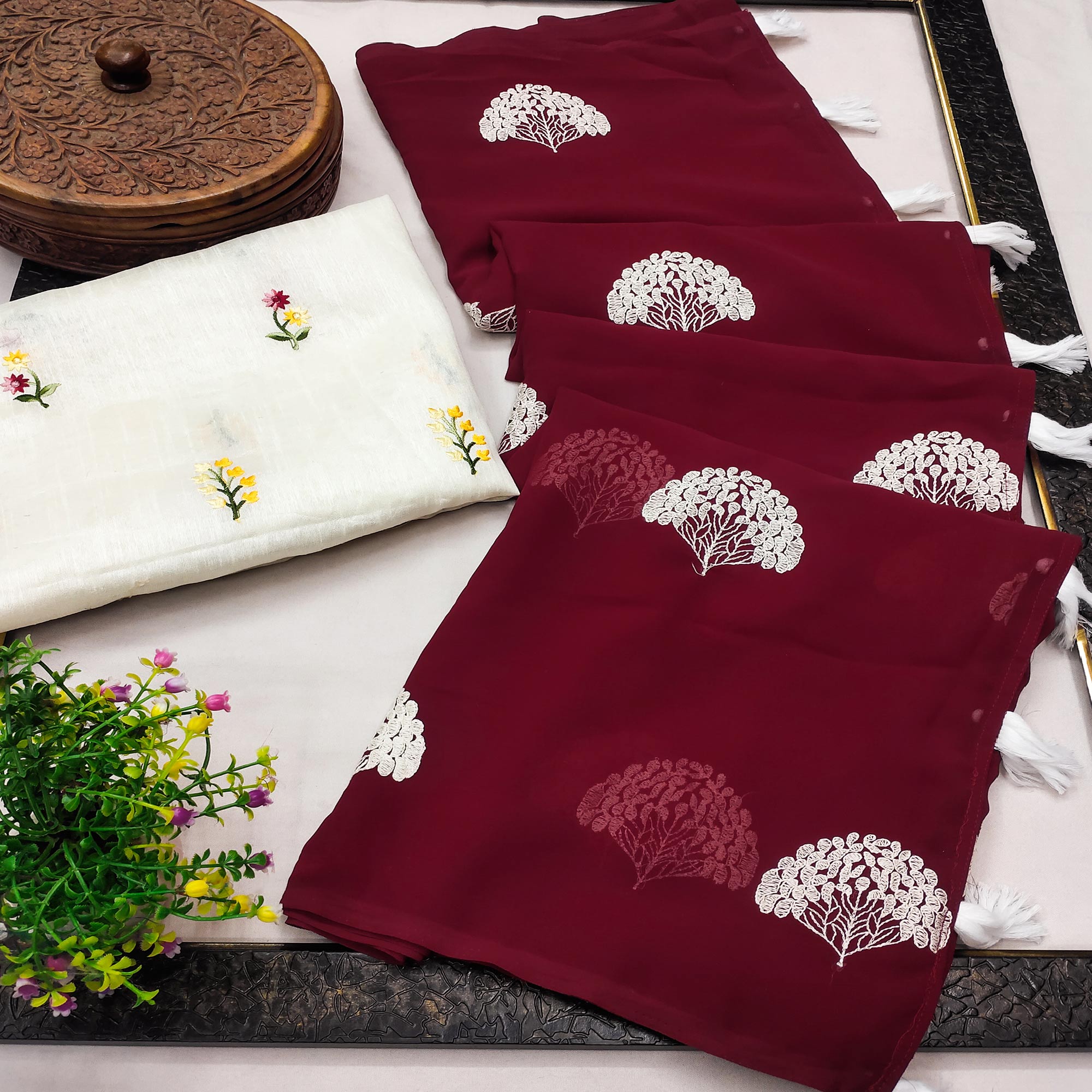 Maroon Thread Embroidered Georgette Saree With Tassels