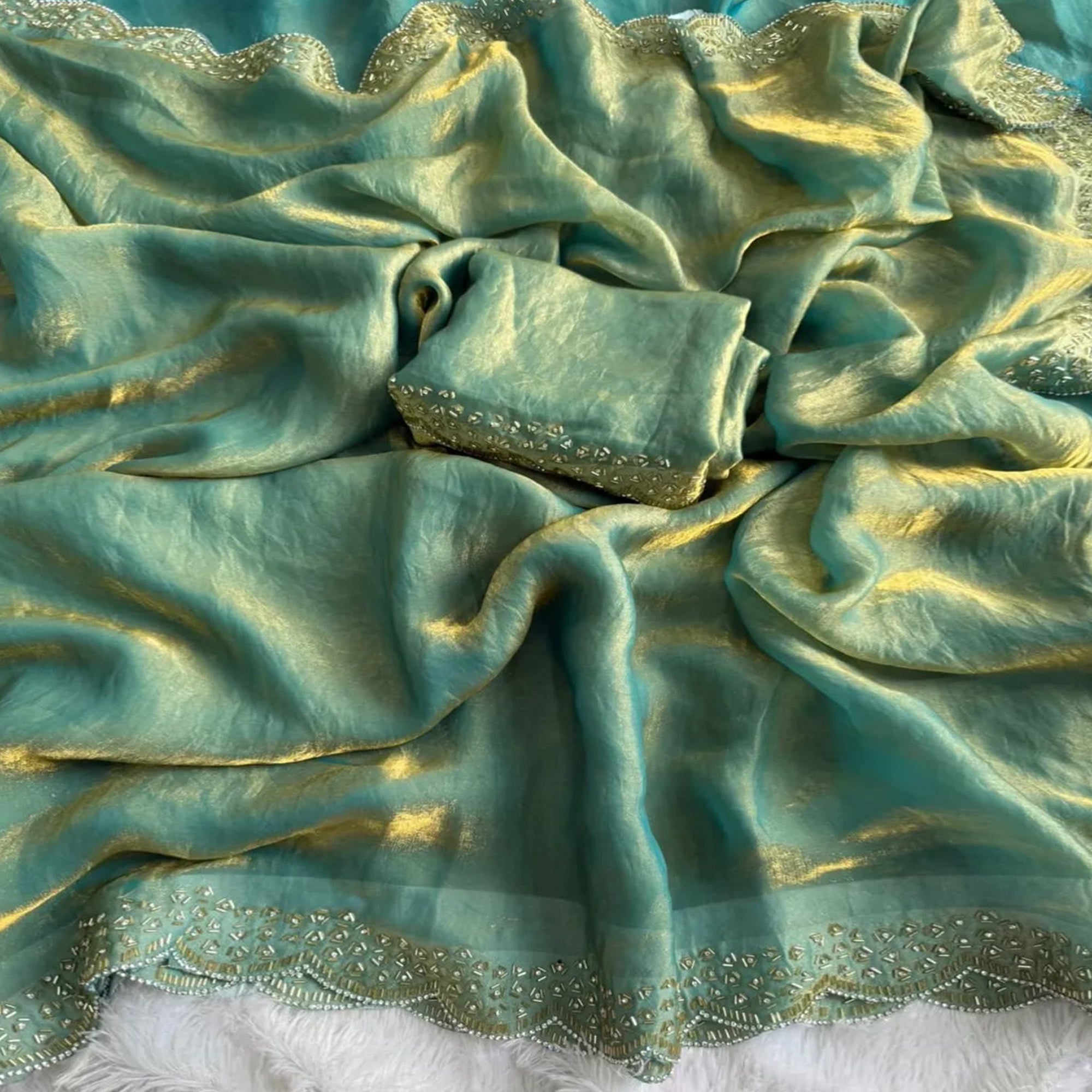 Elegant Sea Green Satin Saree Embellished in Gold Shine