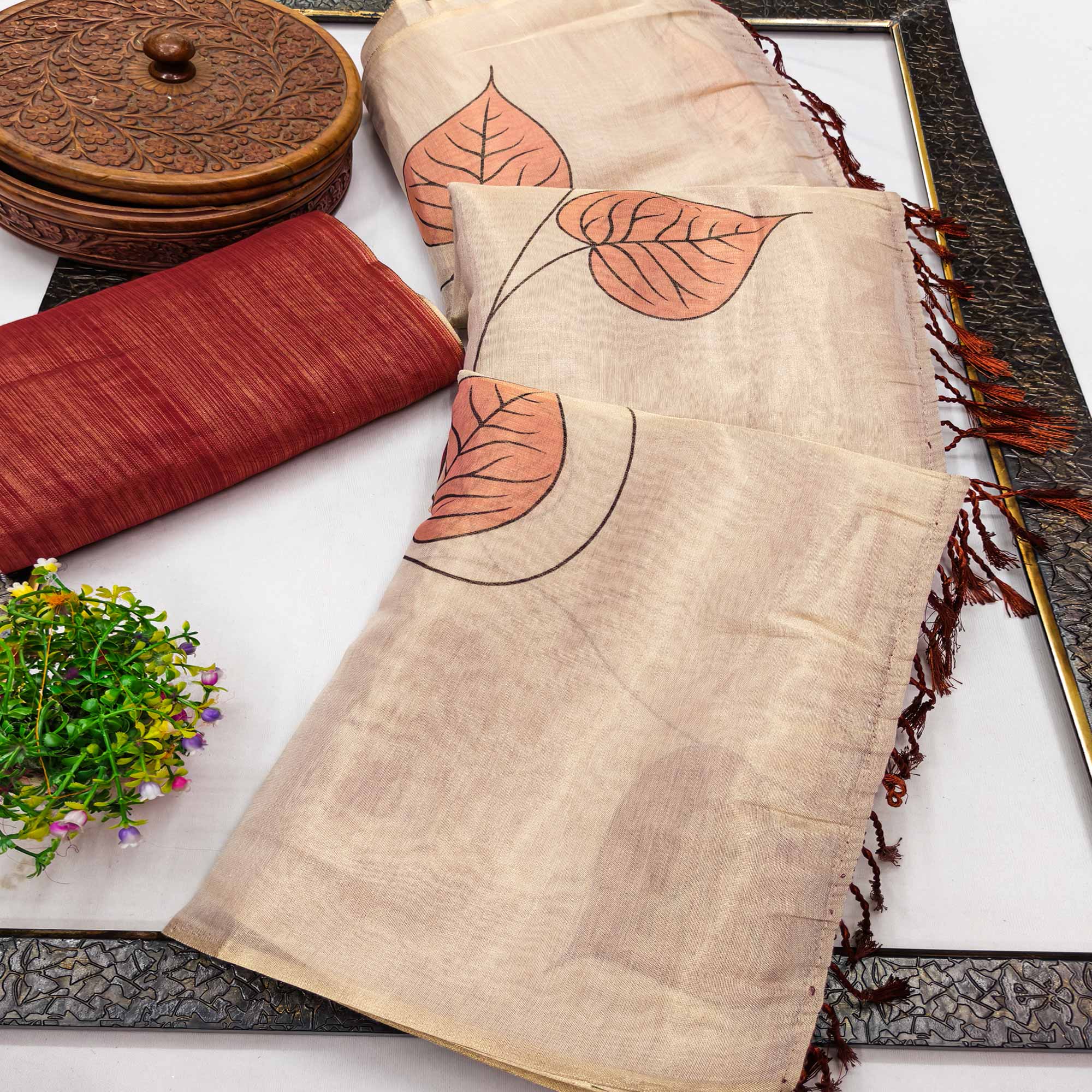 Beige & Rust Saree in Art Silk Featuring Leafy Print & Tassels