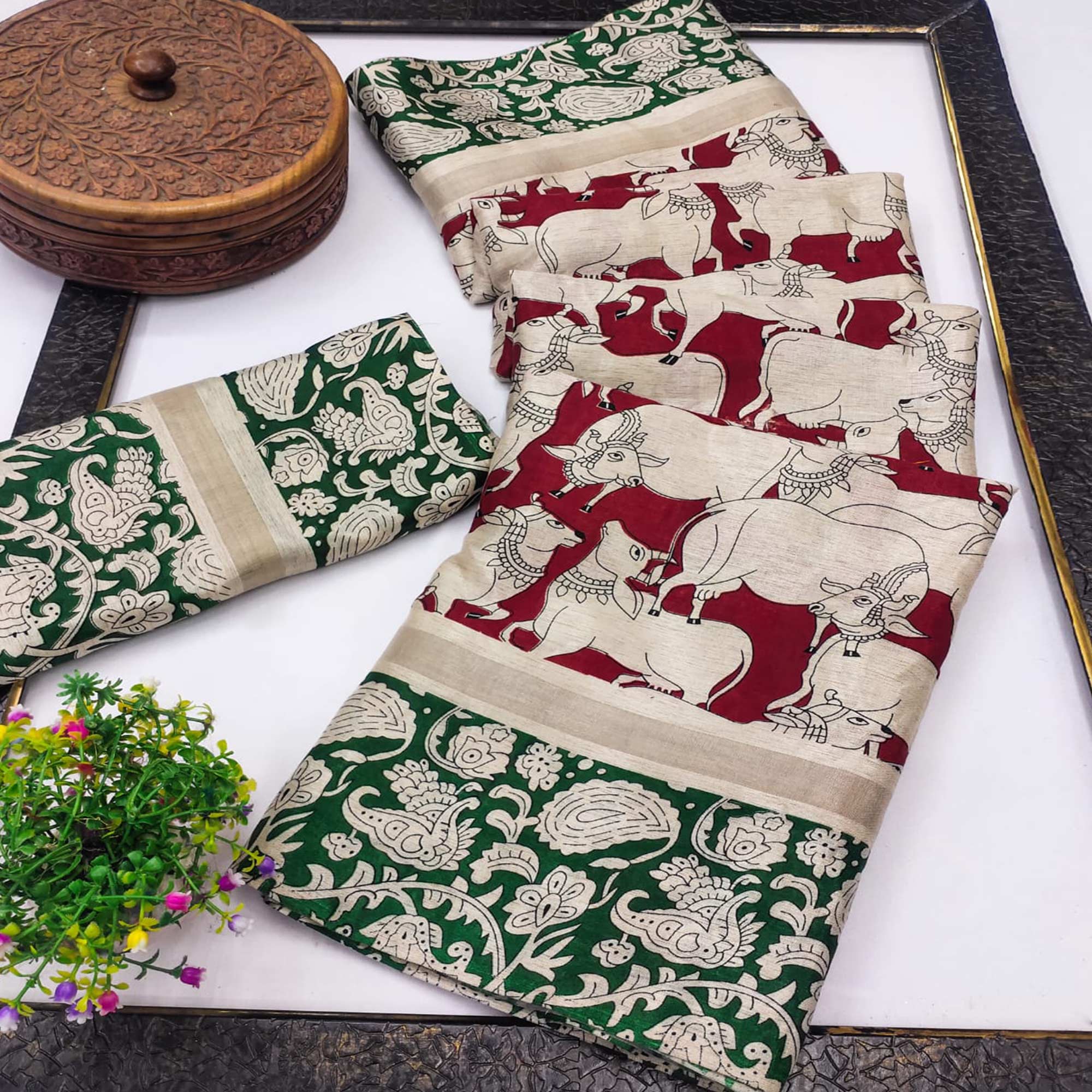Red & Green Cotton Blend Saree Featuring Artistic Animal And Floral Print Fusion