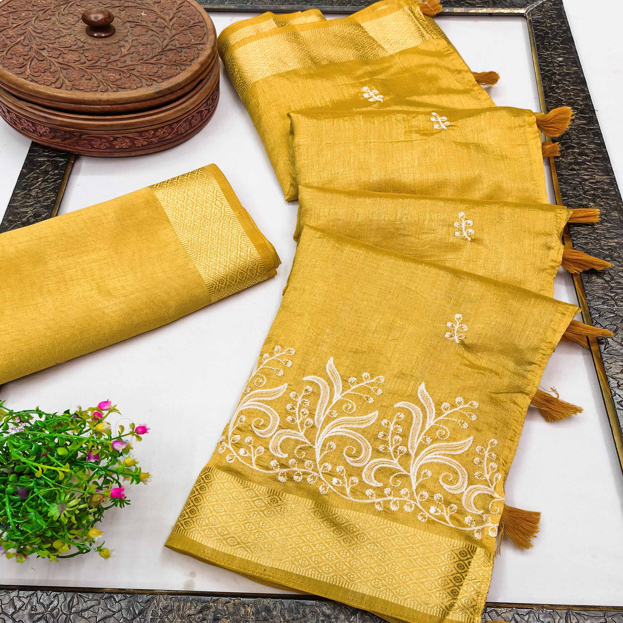 Mustard Art Silk Saree Adorned With Delicate Floral Embroidery & Stylish Tassel Pallu