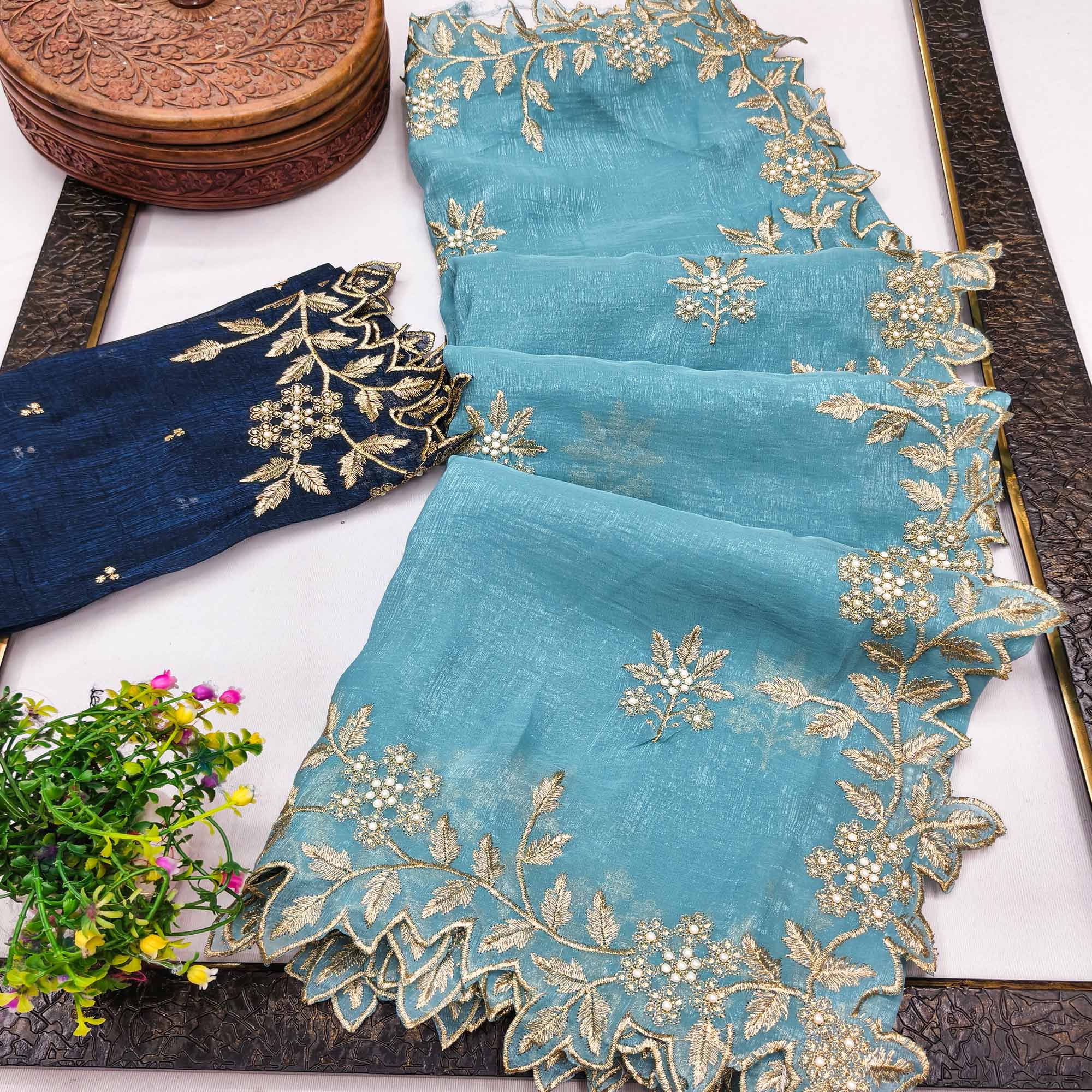 Regal Sky Blue Chiffon Saree Adorned with Intricate Golden Embroidery