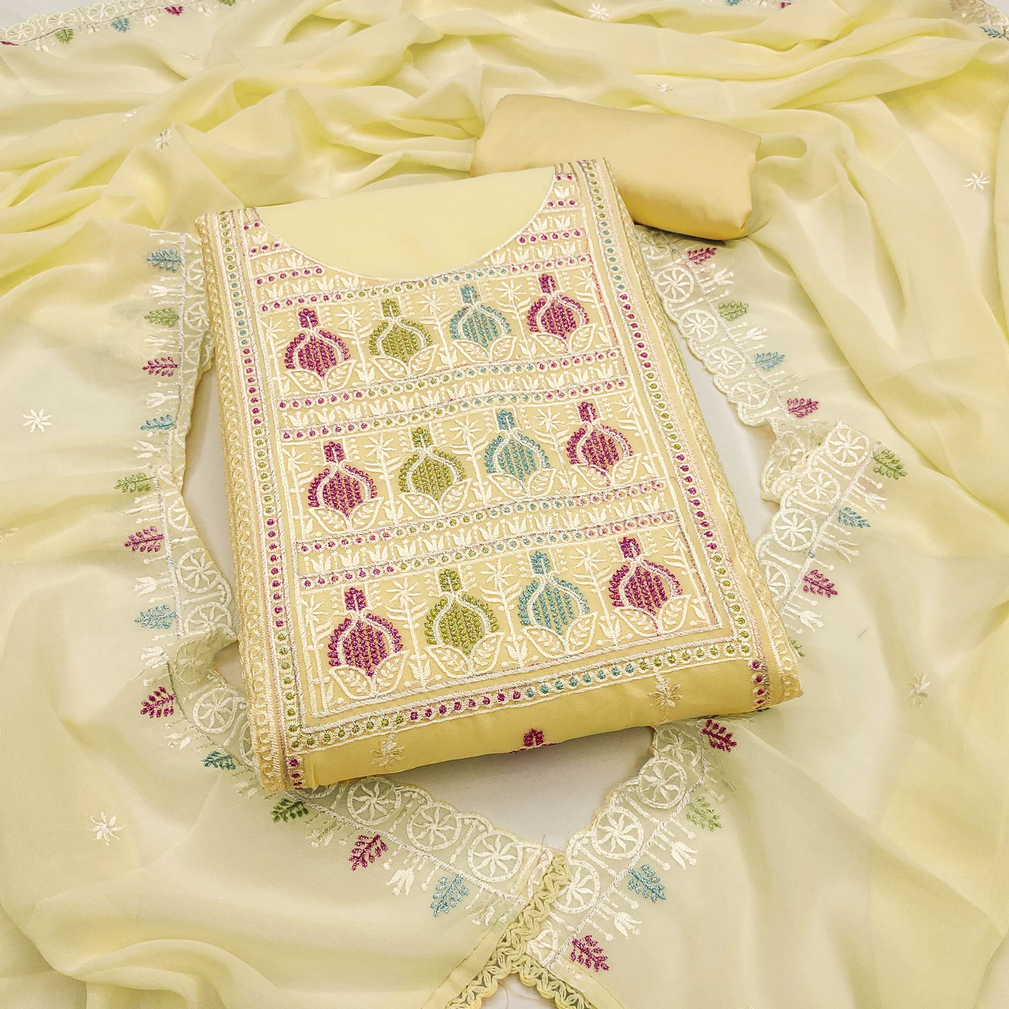 Sophisticated Yellow Georgette Dress Material Accented With Ornate Floral Thread Embroidery