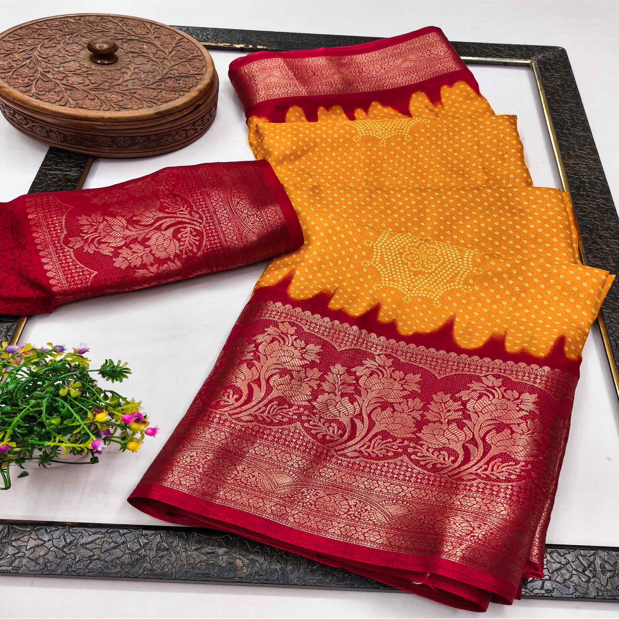 Orange Bandhani Printed Dola Silk Saree Adorned With Luxe Floral Weaving Border Work