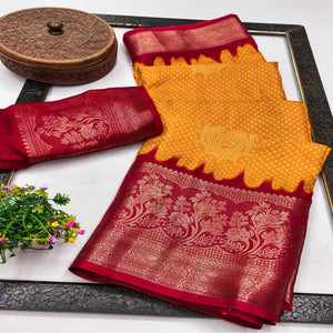 Orange Bandhani Printed Dola Silk Saree Adorned With Luxe Floral Weaving Border Work