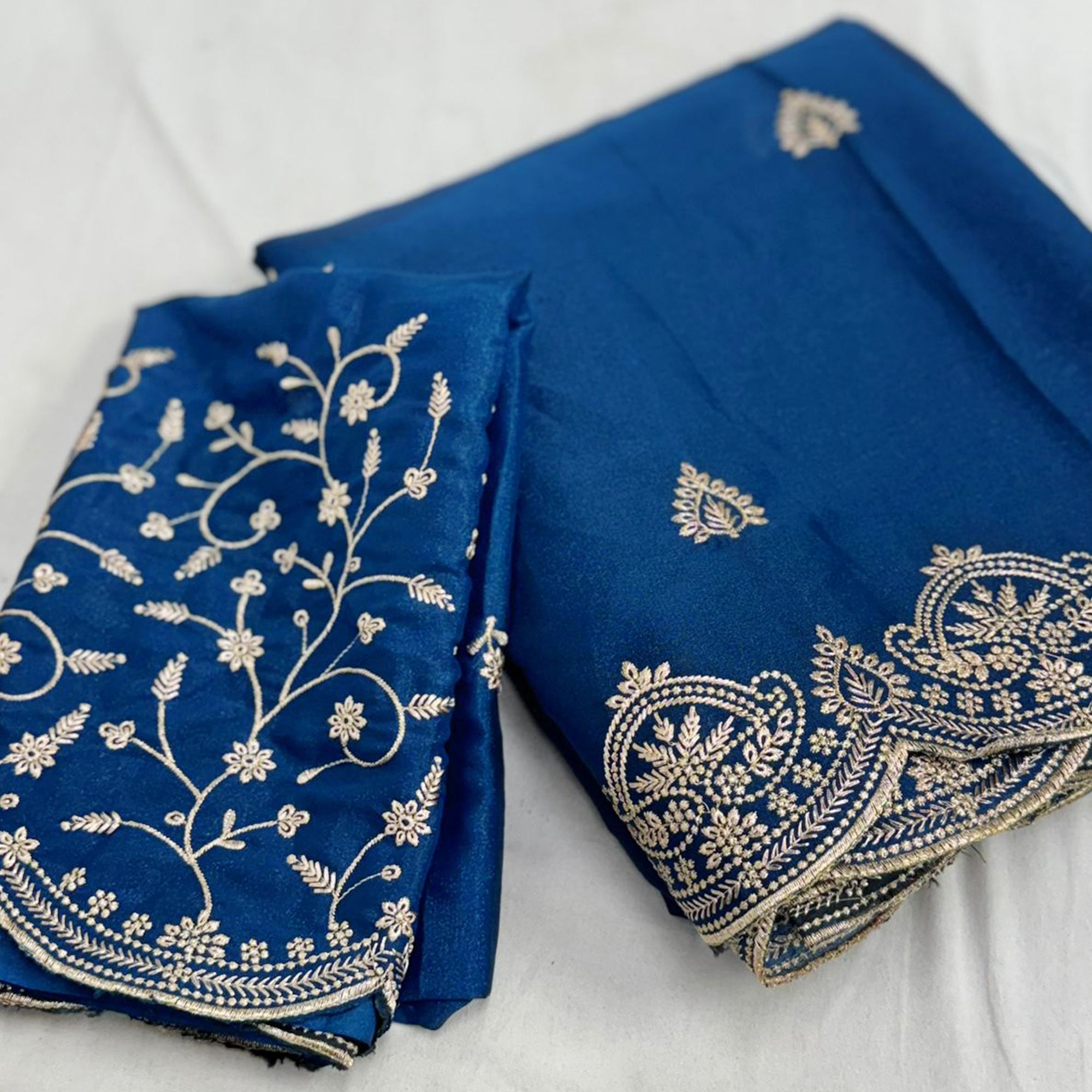 Gorgeous Blue Floral Embroidered Georgette Saree Accented With Luxurious Zari Work