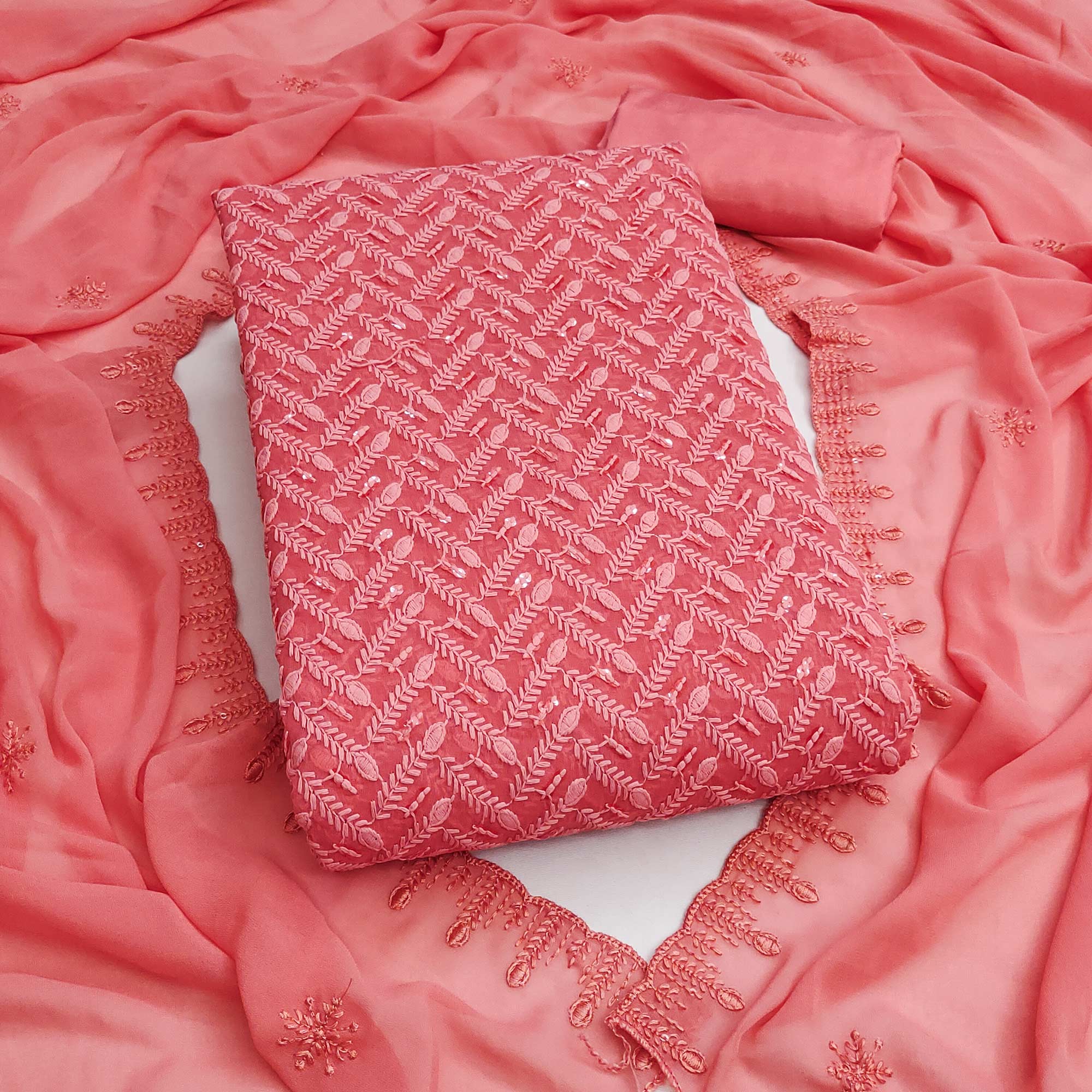 Lightweight Coral Pink Georgette Dress Material Adorned with Beautiful Floral Embroidery