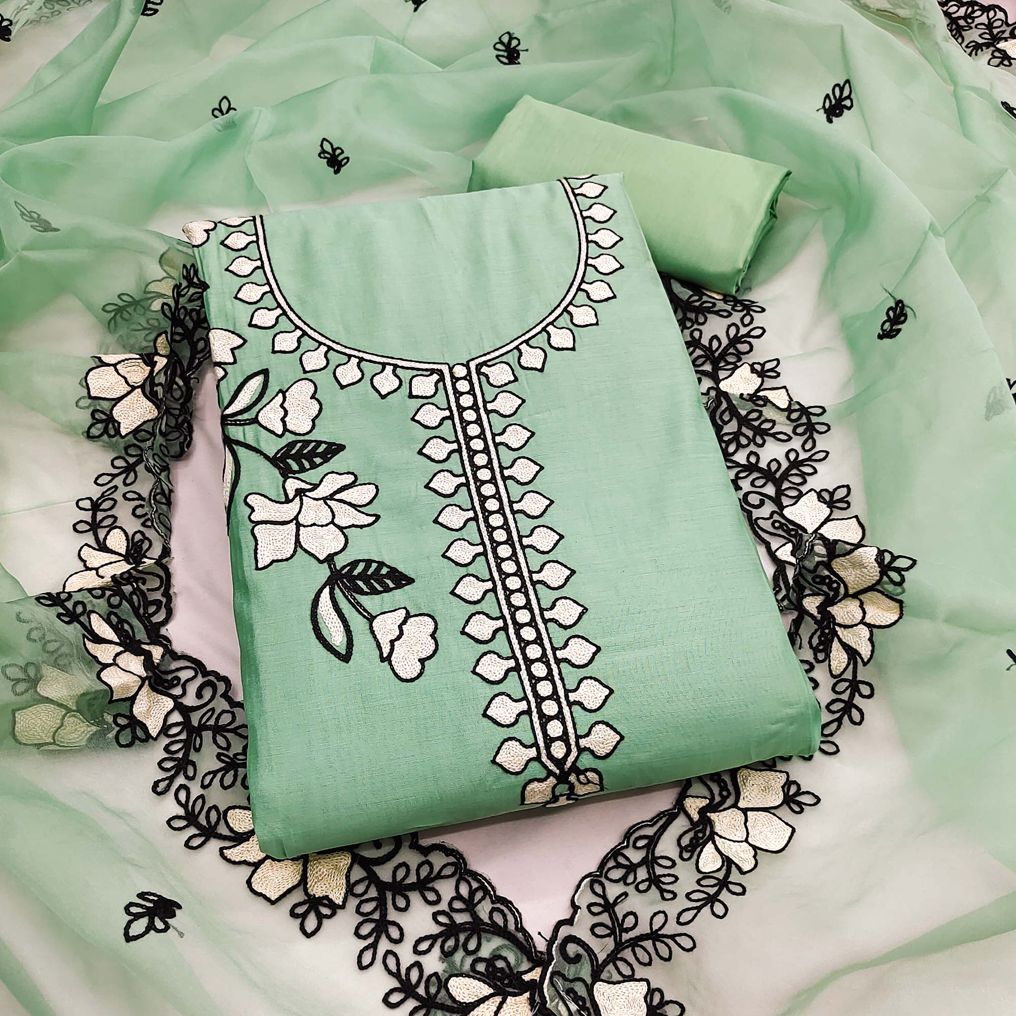Graceful Mint Green Floral Viscose Dress Material Enhanced With Intricate Thread Embroidery Work