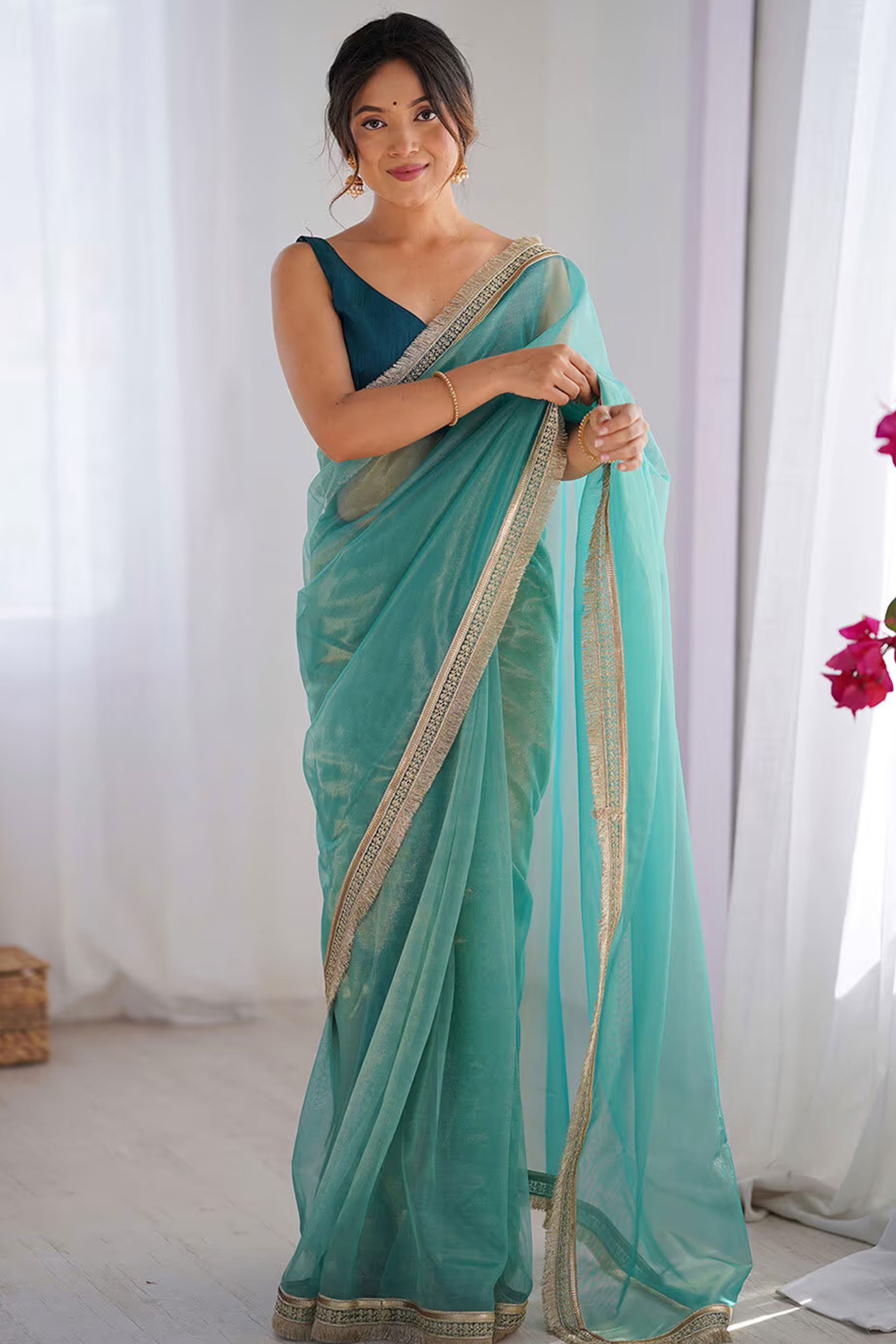 Turquoise Solid Pattern Net Saree with Refined Lace Work for Parties