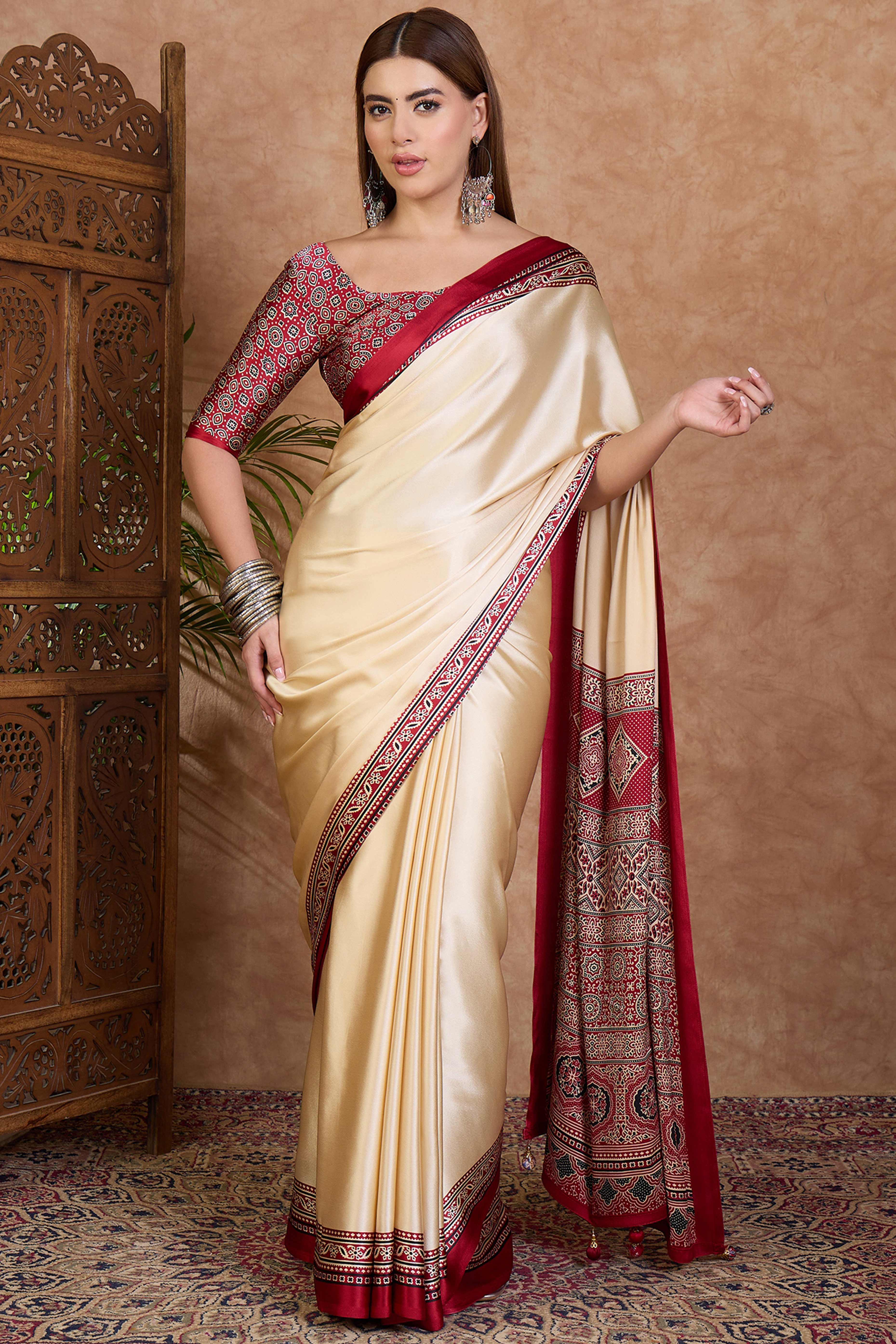 Cream & Red Modal Satin Saree Featuring a Solid Base and Artisanal Ajrakh Pallu