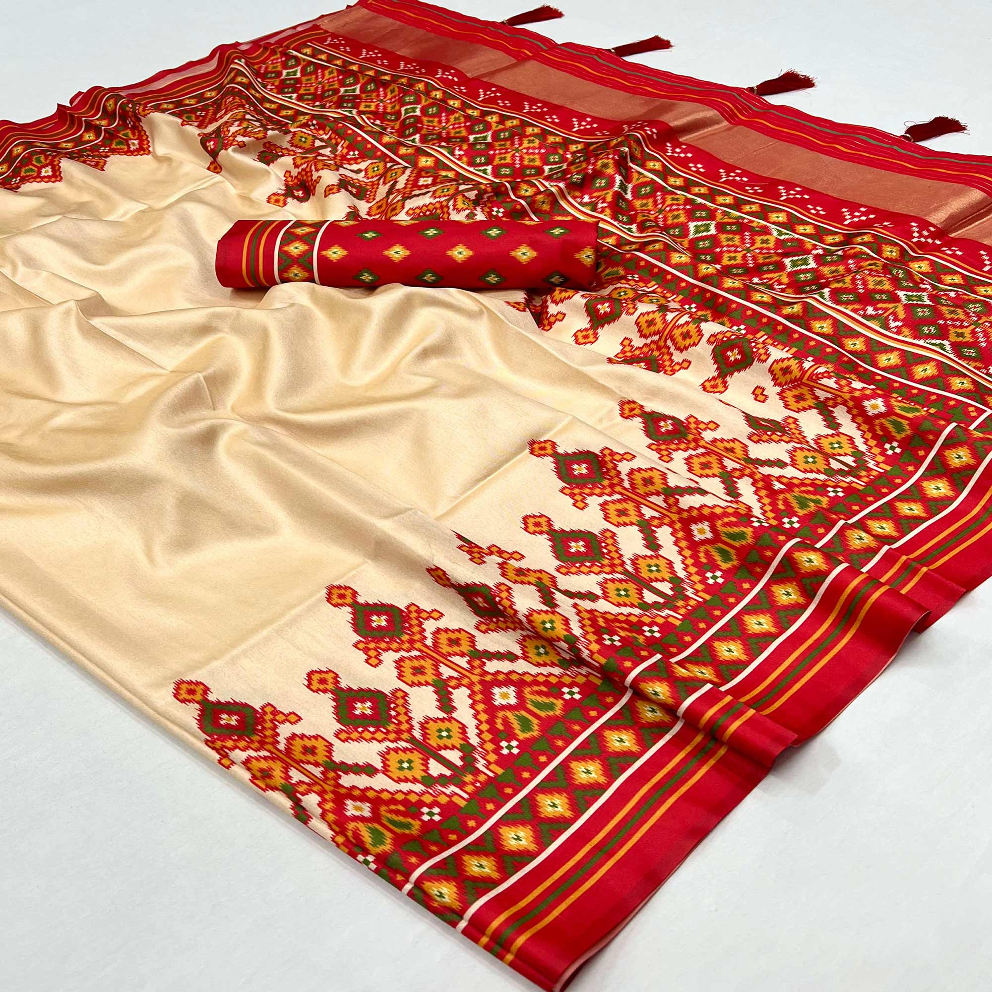 Cream Patola Printed Tussar Silk Saree With Tassels