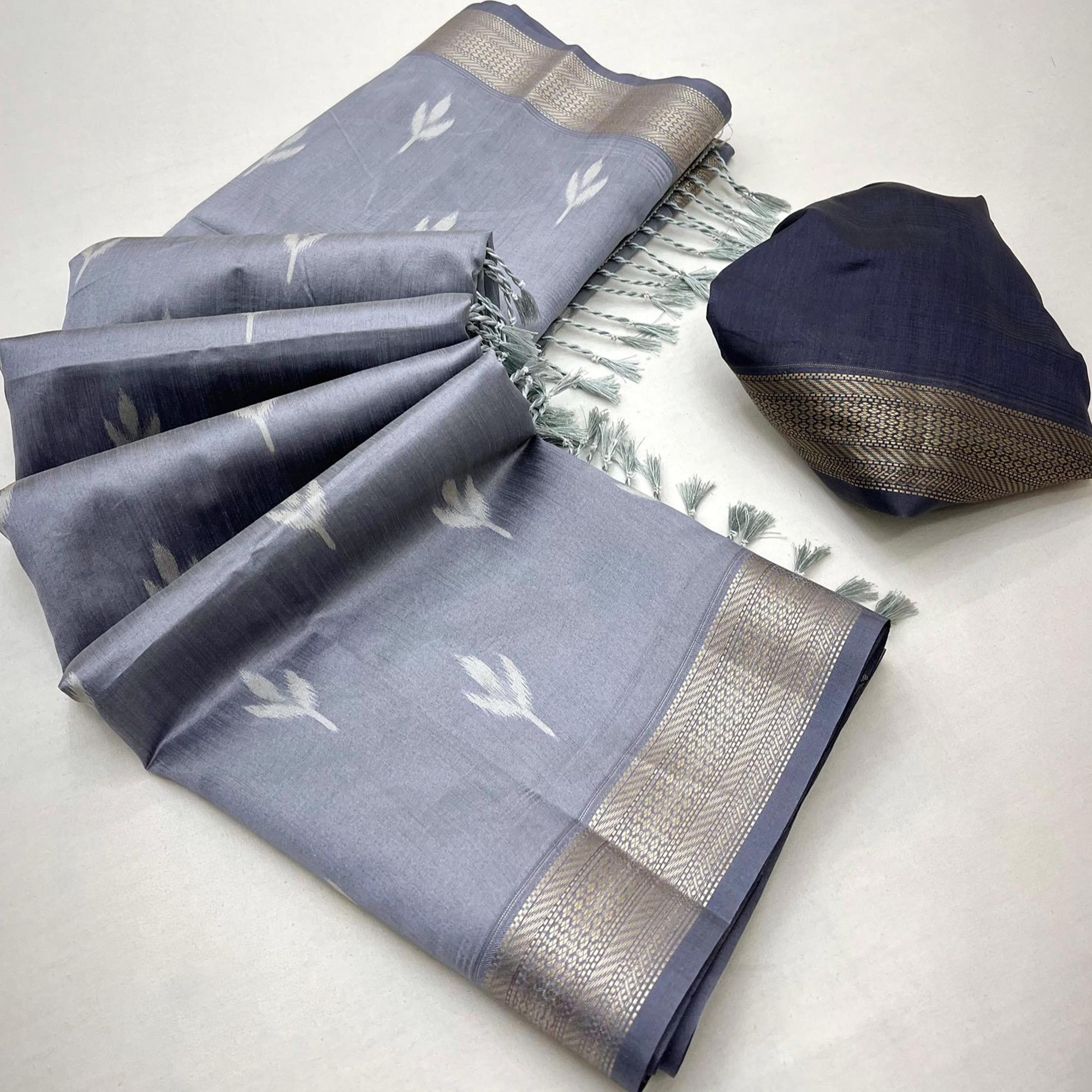 Grey Ikkat Style Rayon Silk Saree with Luxurious Zari Border and Delicate Tassels