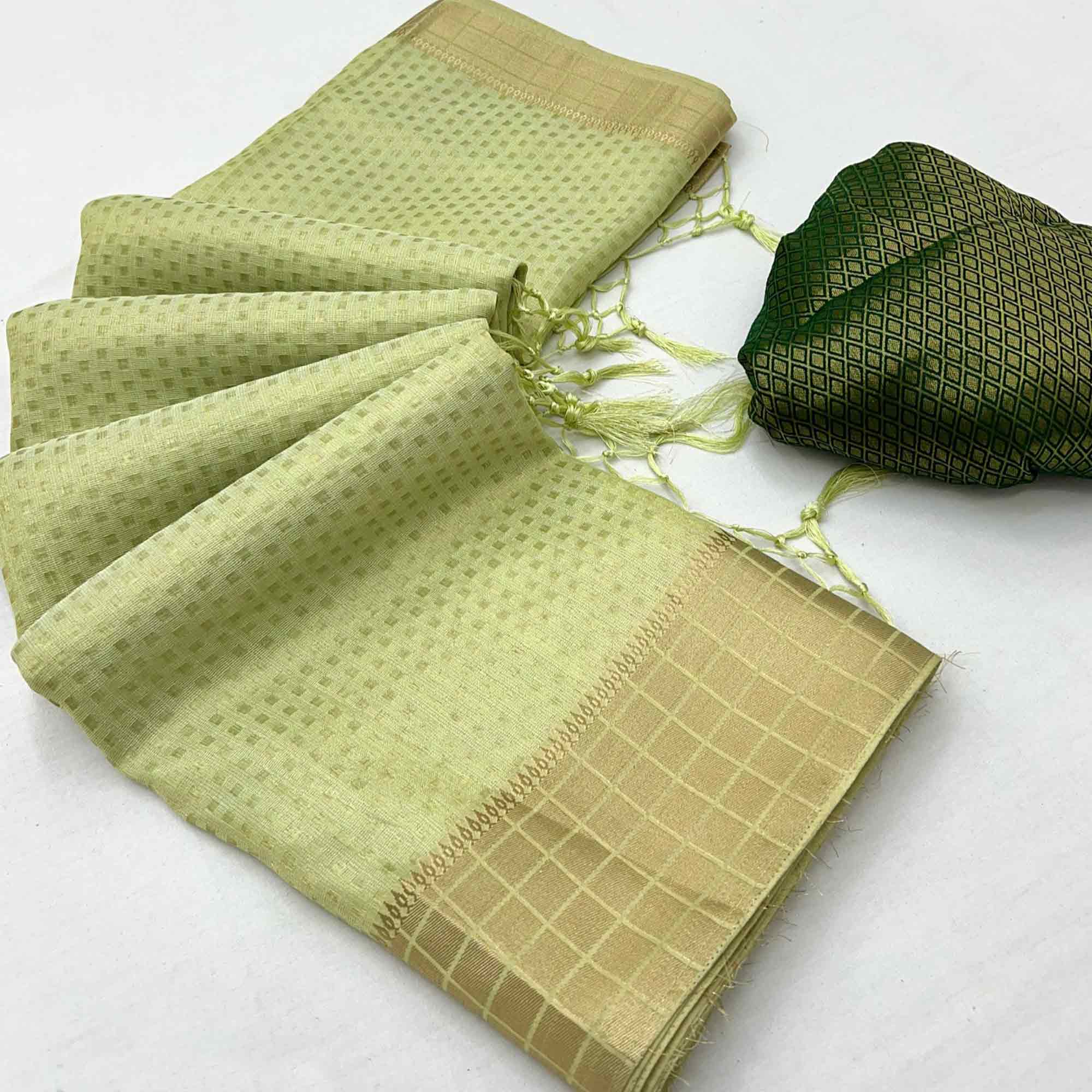 Green Soft Tissue Saree Featuring Rich Zari-Woven Detailing.