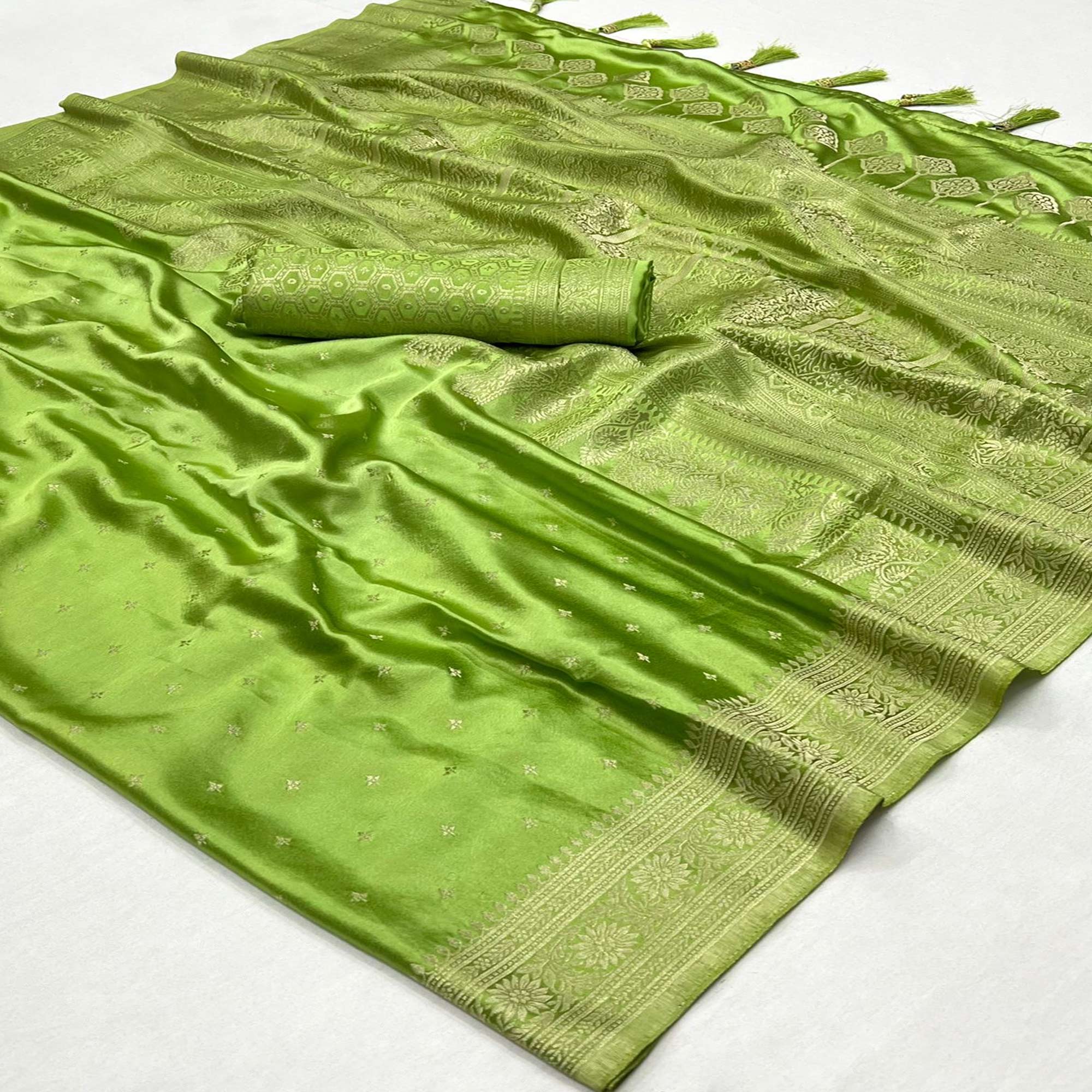 Green Zari Woven Satin Saree With Tassels