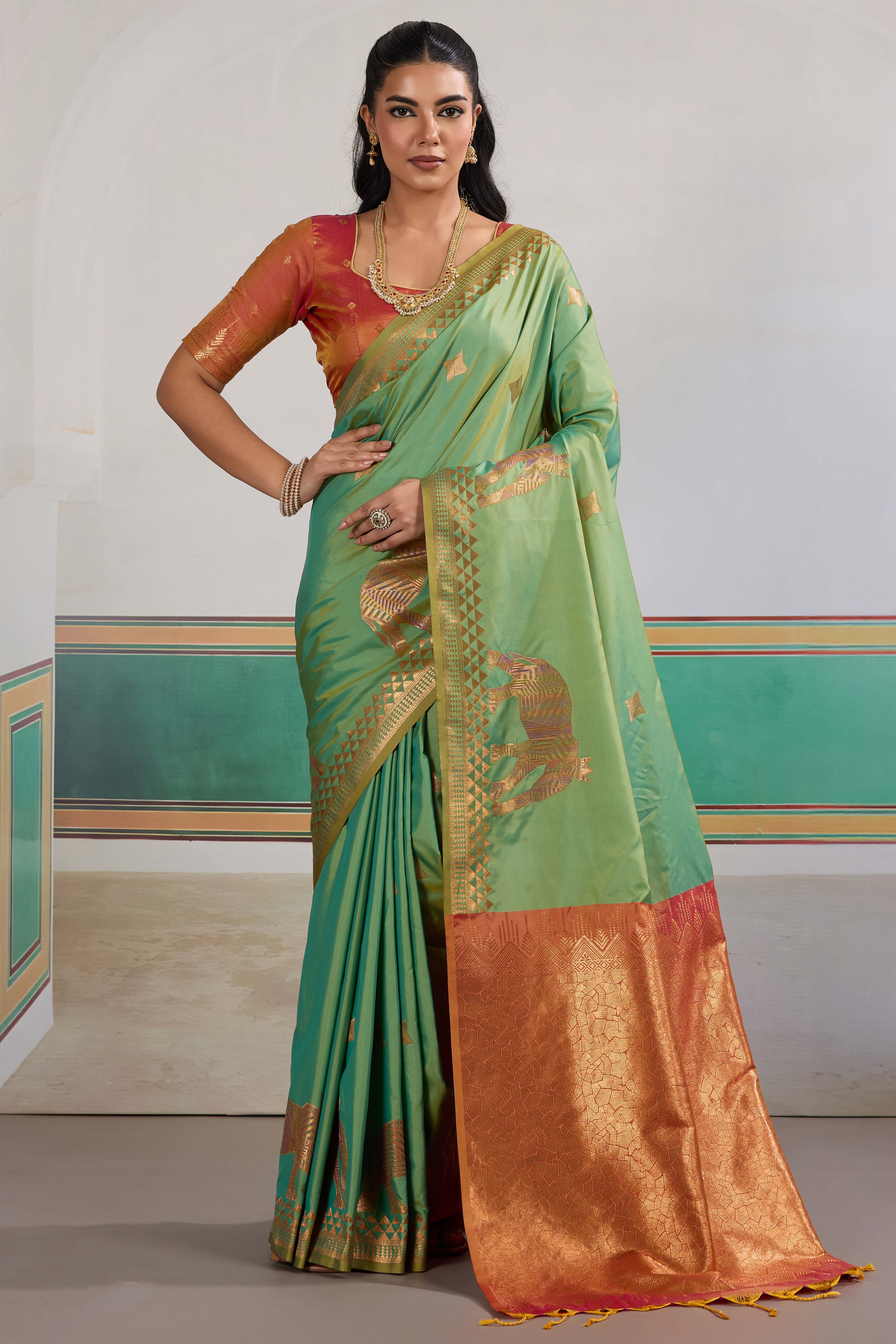 Traditional Green Pure Silk Saree Featuring Elephant Motif Zari Weaving & Tassel Pallu