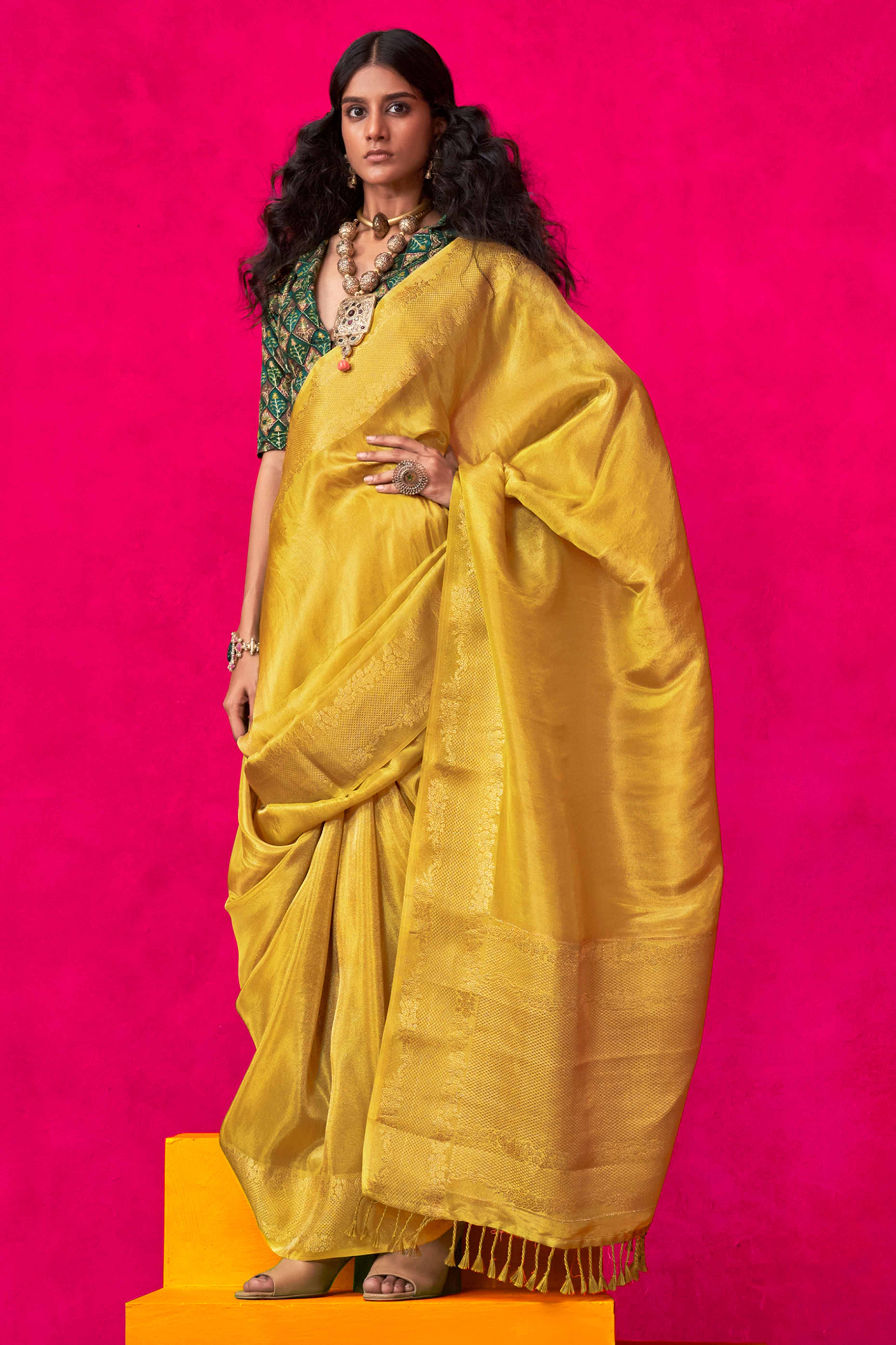 Yellow Tissue Saree Adorned with Zari Weaving Border