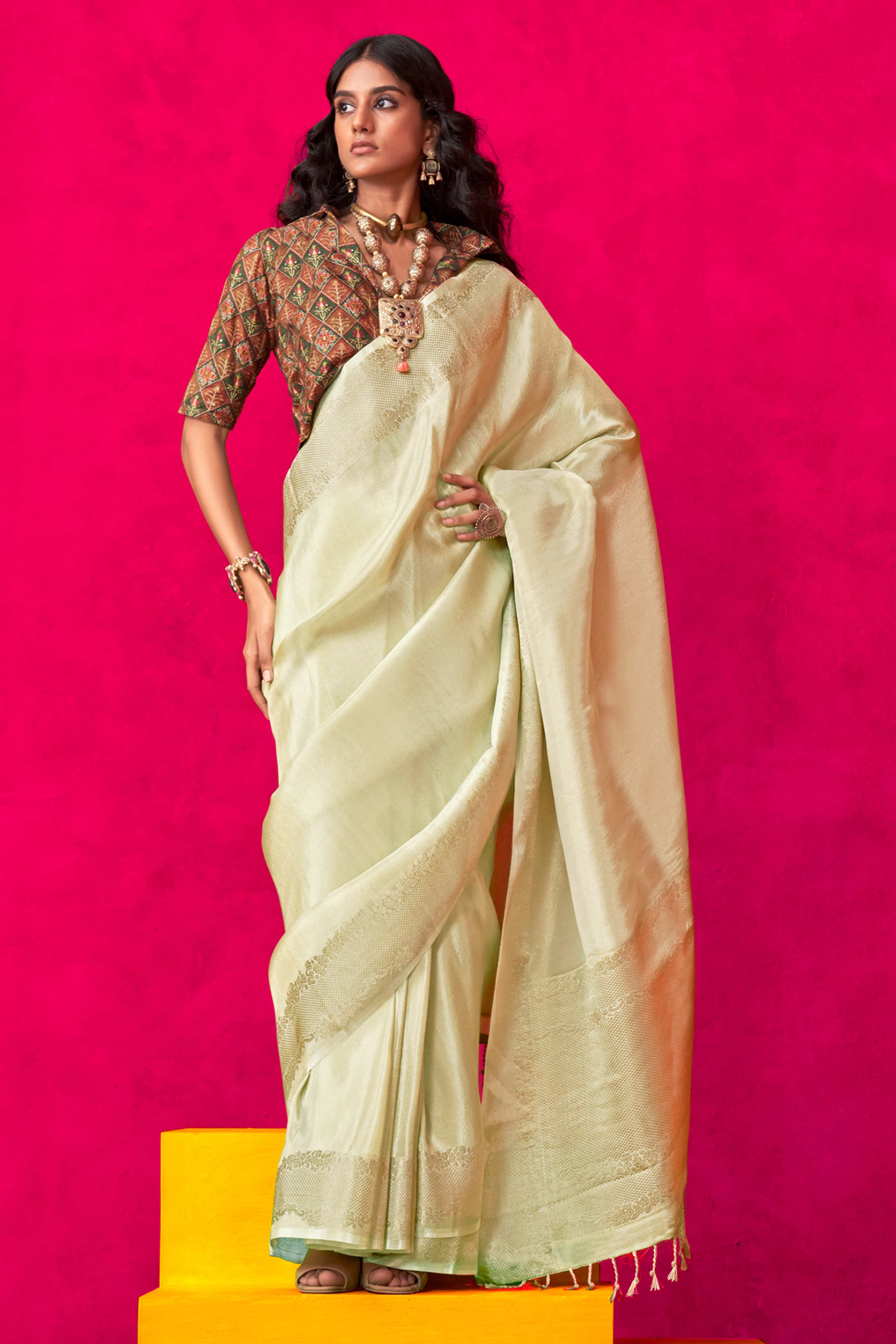 Cream Tissue Saree Adorned with Zari Weaving Border