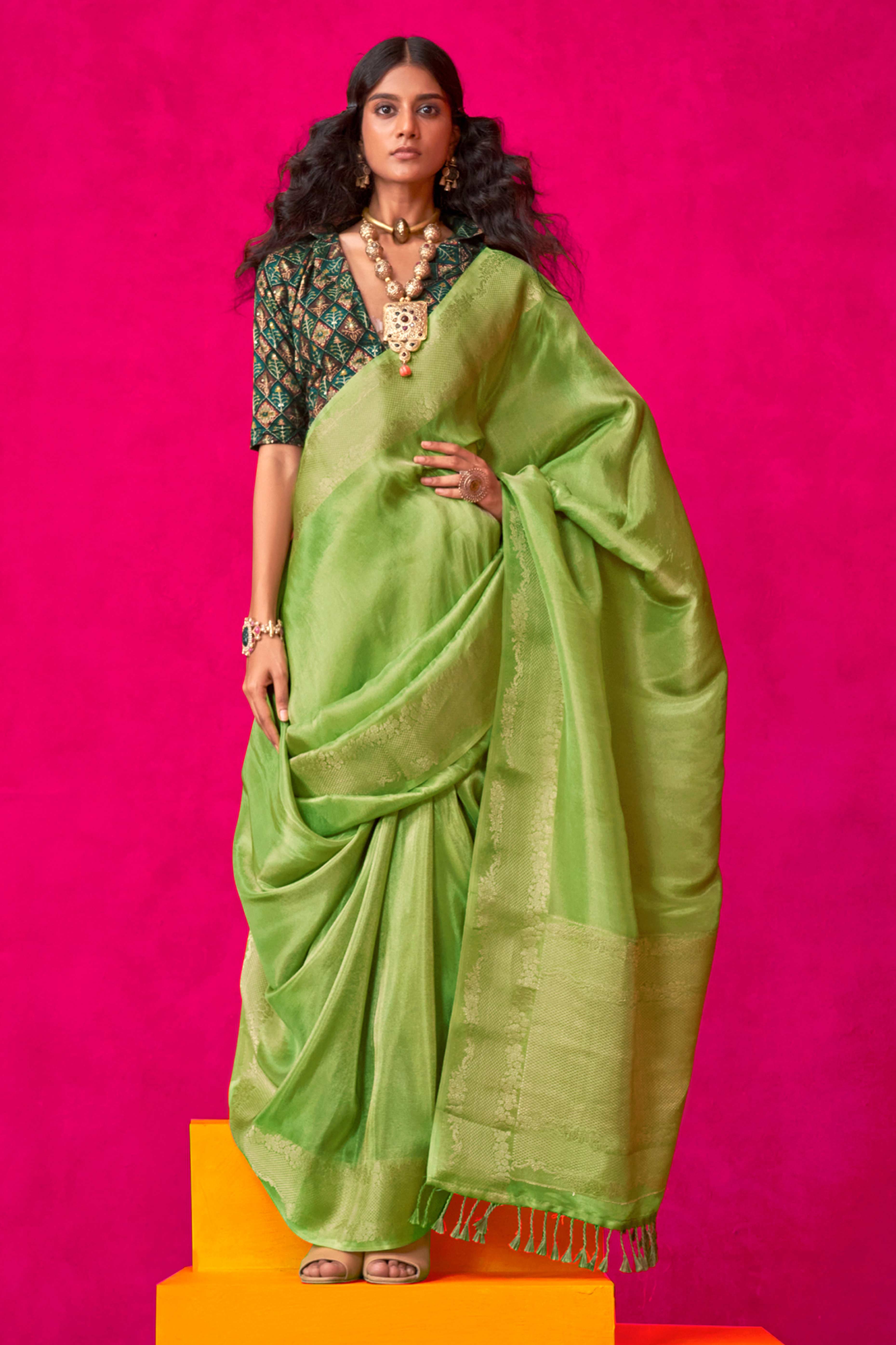 Green Tissue Saree Adorned with Zari Weaving Border
