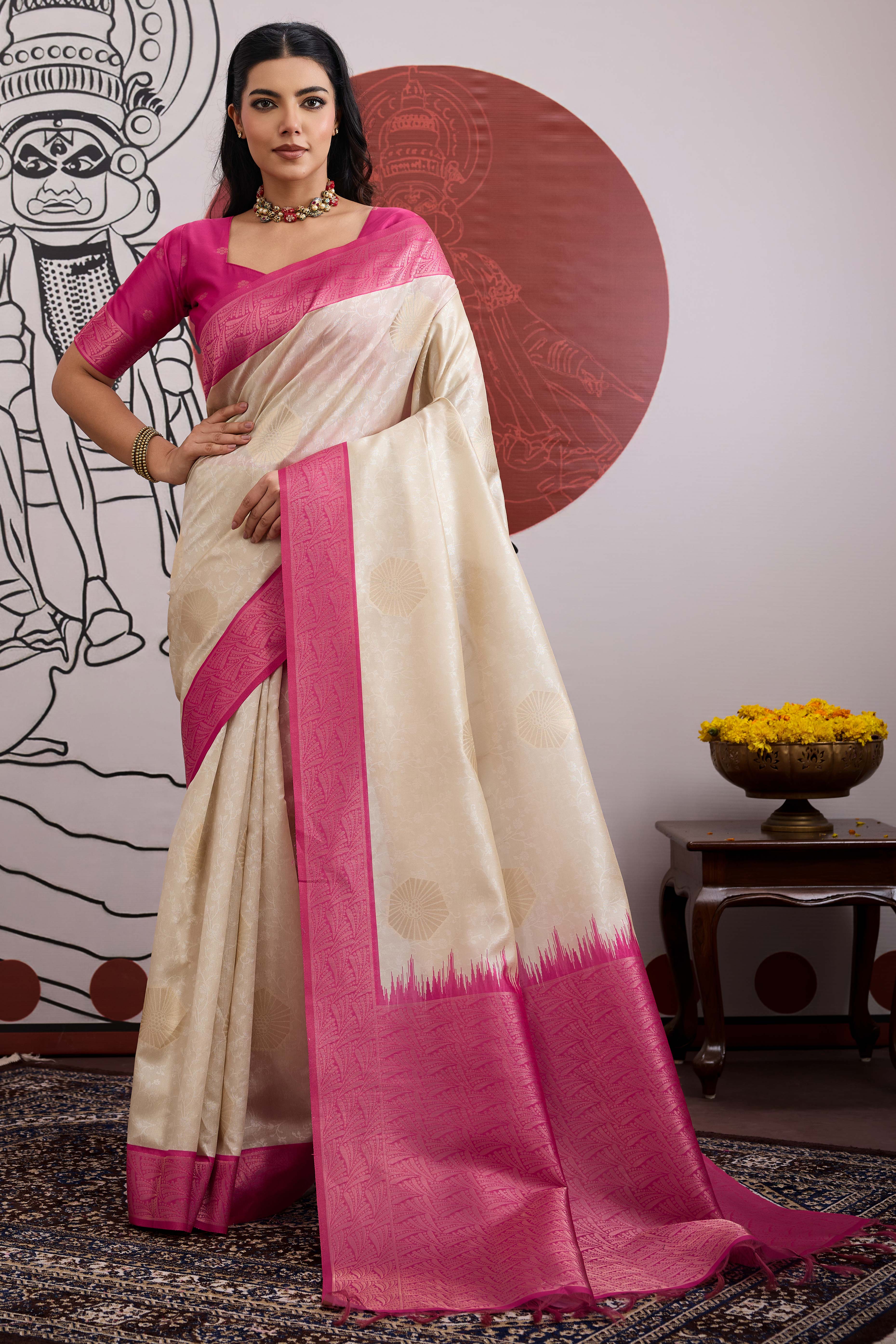Graceful Cream & Pink Zari Weaving Silk Saree Highlighted By Decorative Tassel Pallu