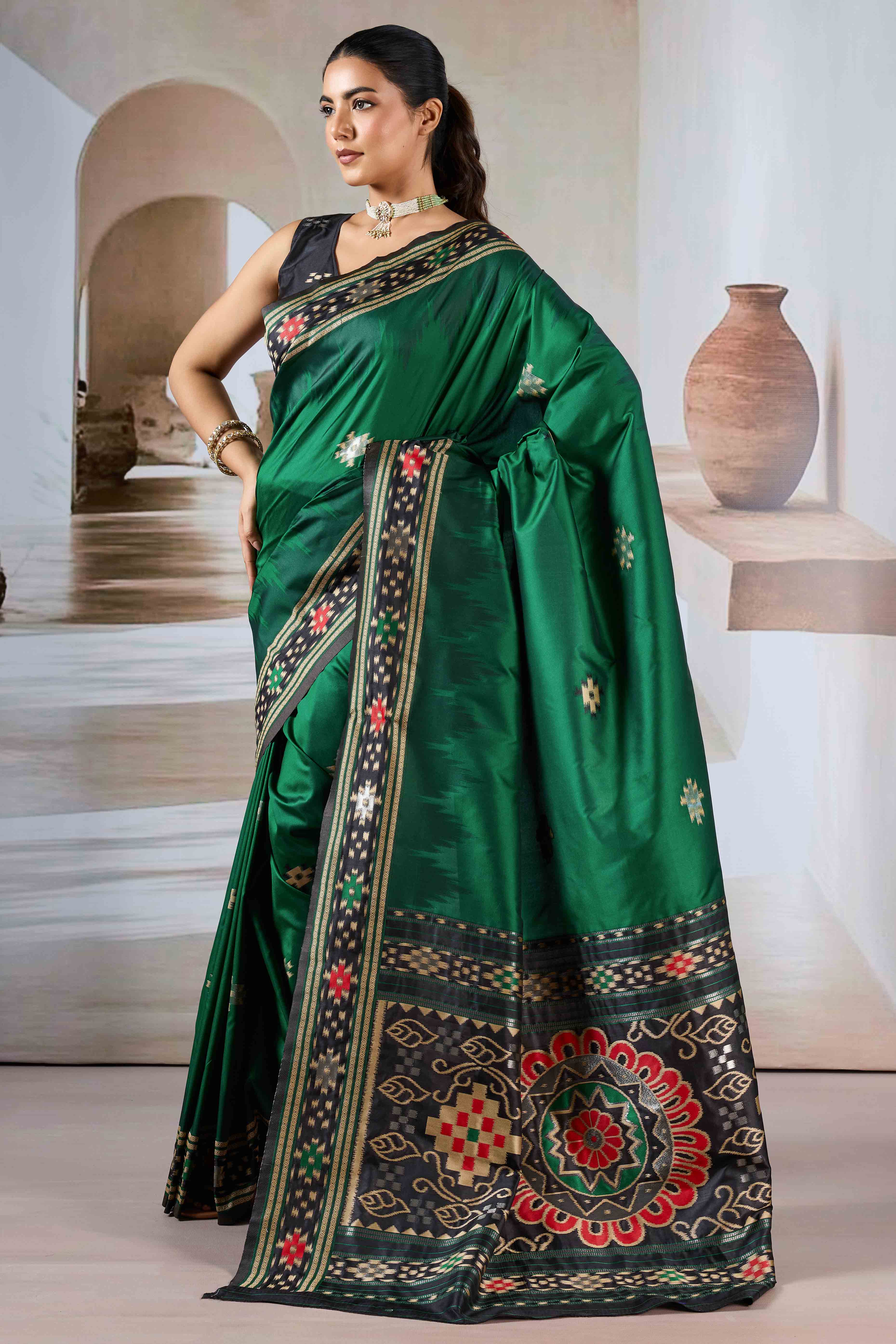 Green Art Silk Saree Adorned with Intricate Patola Style Woven Designs