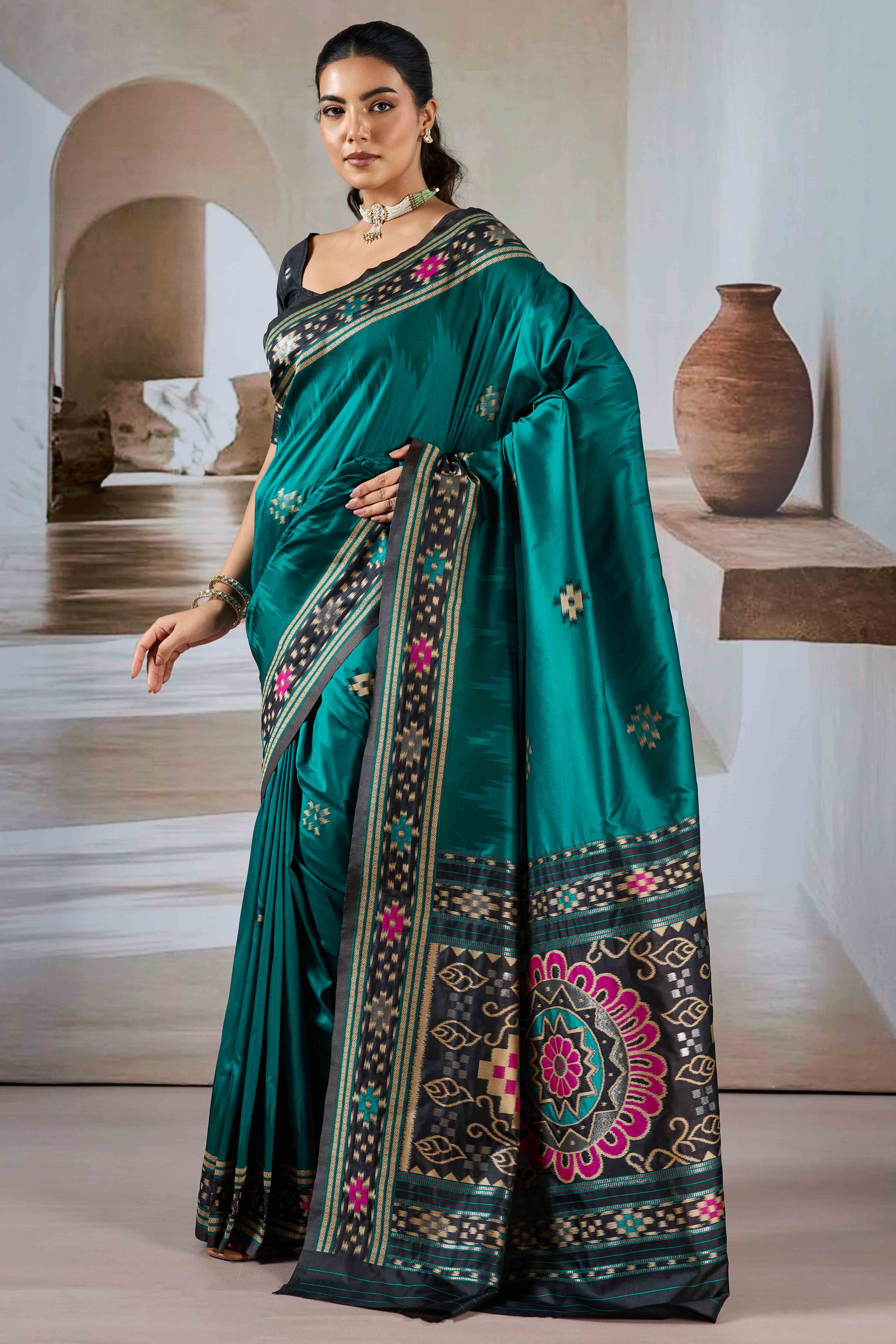 Teal Art Silk Saree Adorned with Intricate Patola Style Woven Designs