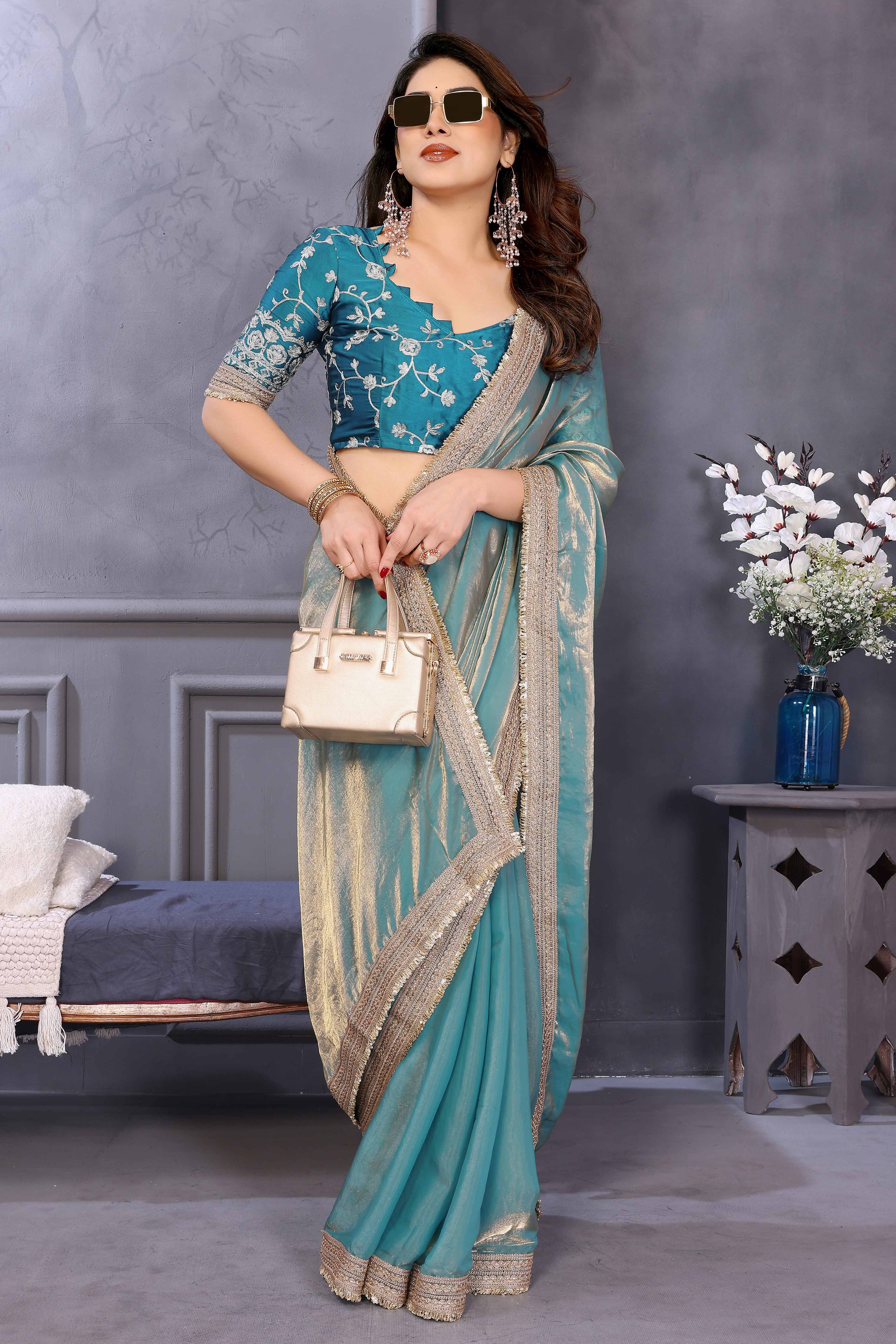 Teal Satin Saree with Solid Body and Decorative Lace Embellished Border – A Modern Ethnic Staple