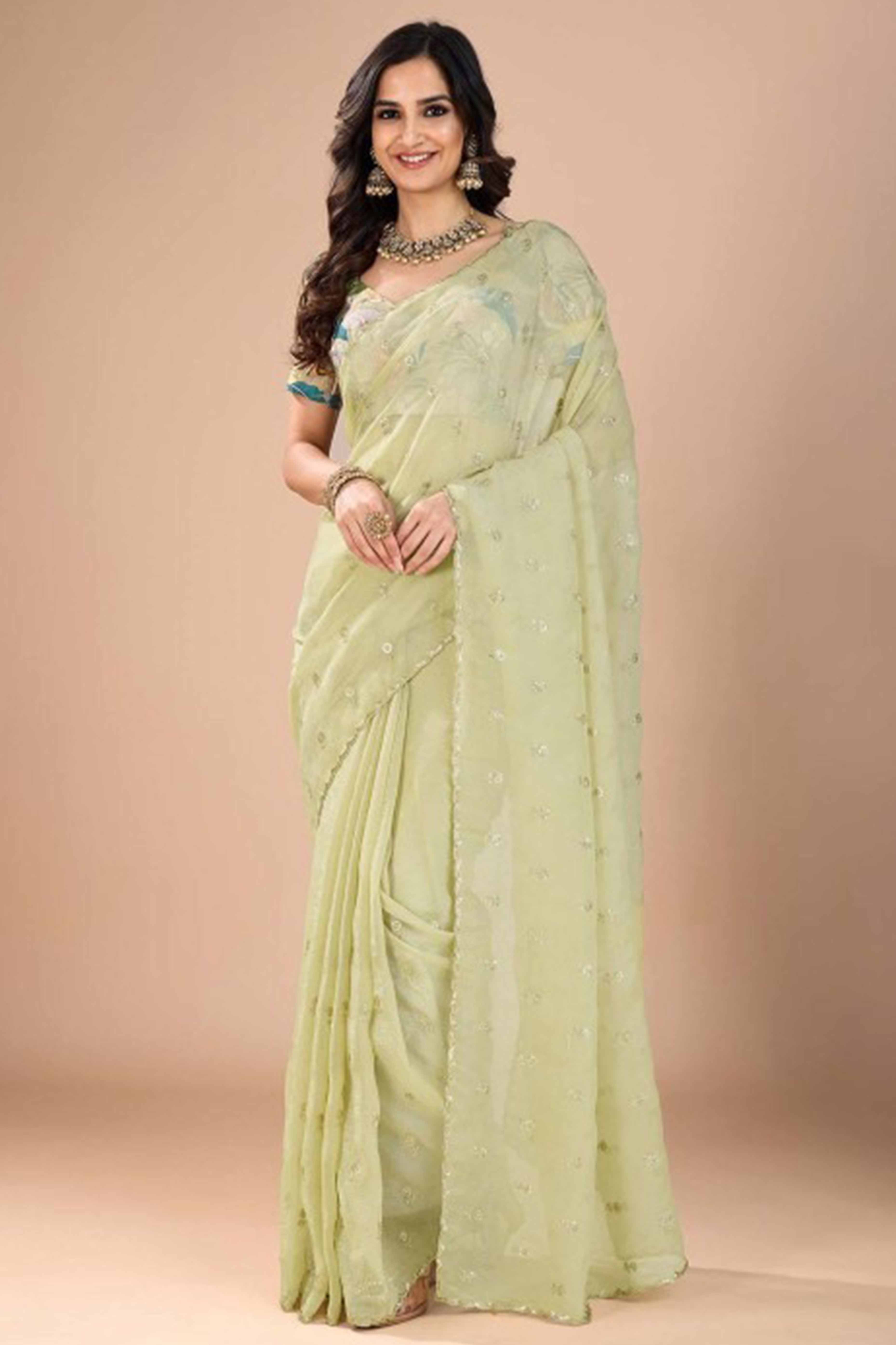 Green Crunchy Saree Adorned With Floral Sequins Embroidery & Graceful Border Finish