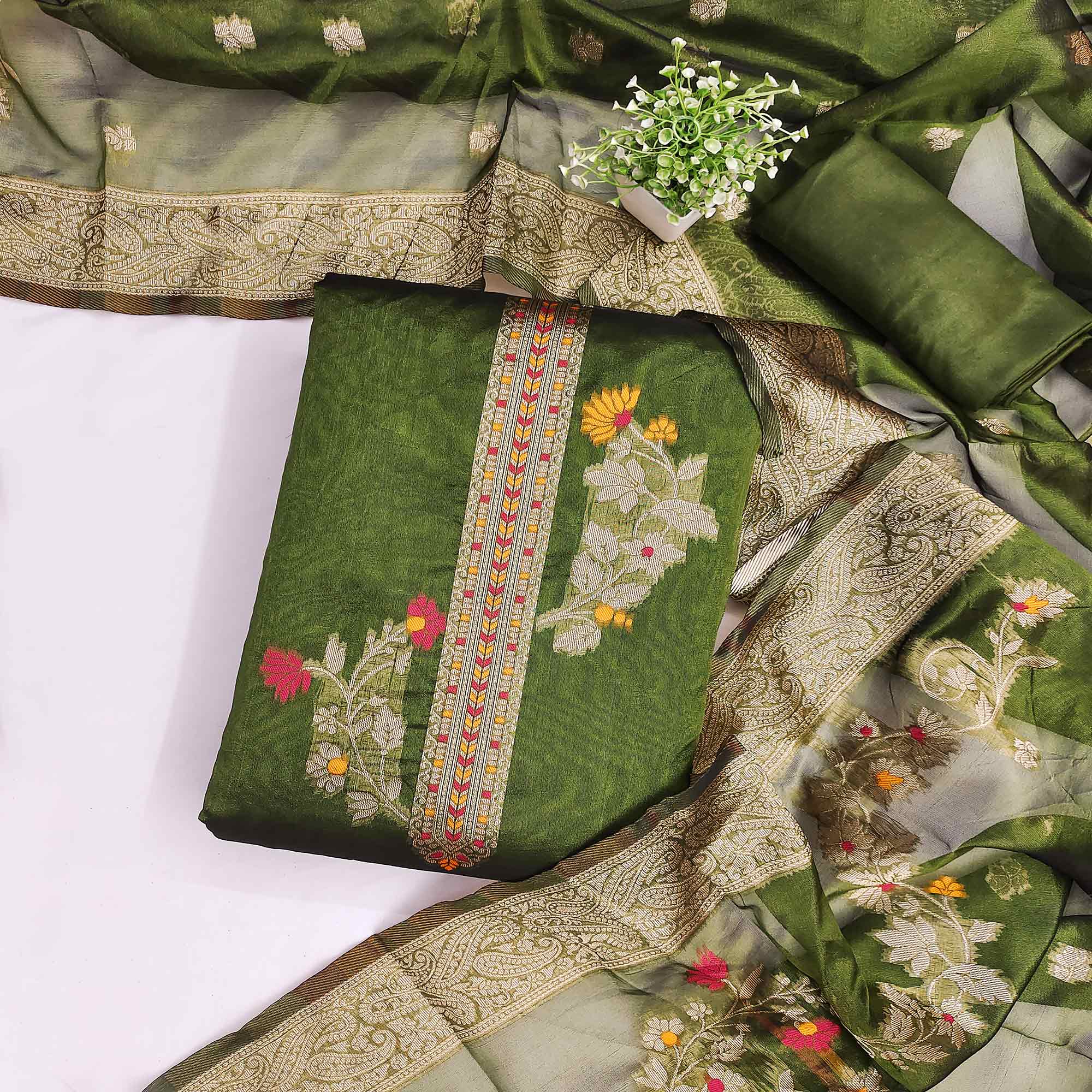 Green Chanderi Silk Dress Material Adorned With Elegant Floral Zari Weaving